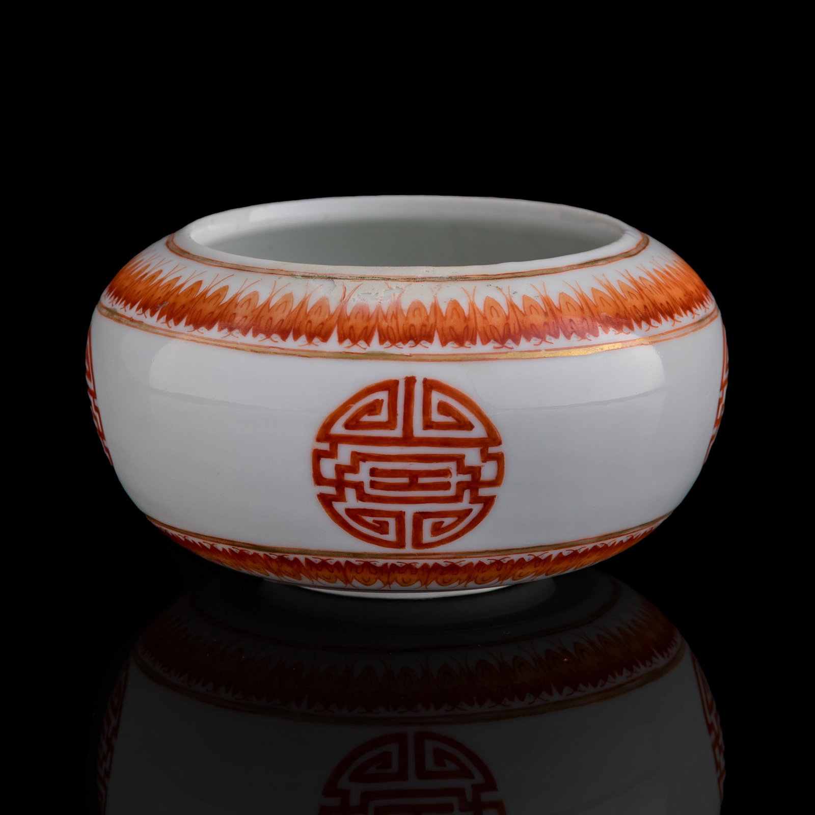 A Chinese gilt-decorated iron red 'shou' water coupe, 19th century: A Chinese gilt-decorated iron red 'shou' water coupe 19th century H: 2 1/4, Dia: 4 1/4 in. (H: 5.7, Dia: 10.8 cm.) Private collection, Florida. Click here f