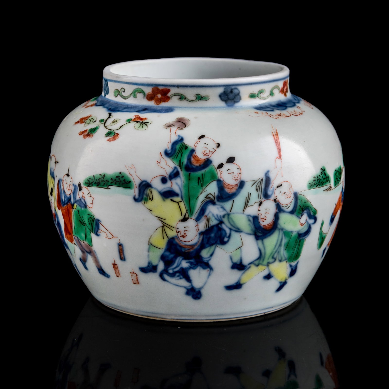 A Chinese blue and enamel 'children playing' jar, late 19th century: A Chinese blue and enamel 'children playing' jar late 19th century The underside with a six-character mark within a double circle. H: 3 1/4, Dia: 4 1/8 in. (H: 8.3, Dia: 10.5 cm.) Private collection, 
