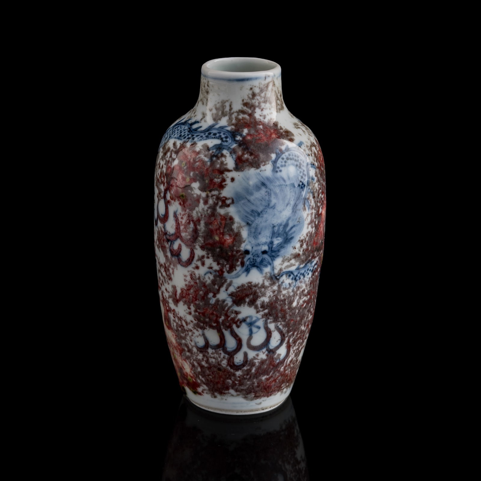 A Chinese blue and copper-red-underglazed 'dragon' vase, early 19th century: A Chinese blue and copper-red-underglazed 'dragon' vase early 19th century H: 5 3/8, Dia: 2 1/2 in. (H: 13.7, Dia: 6.4 cm.) Private collection, Lilburn, Georgia.