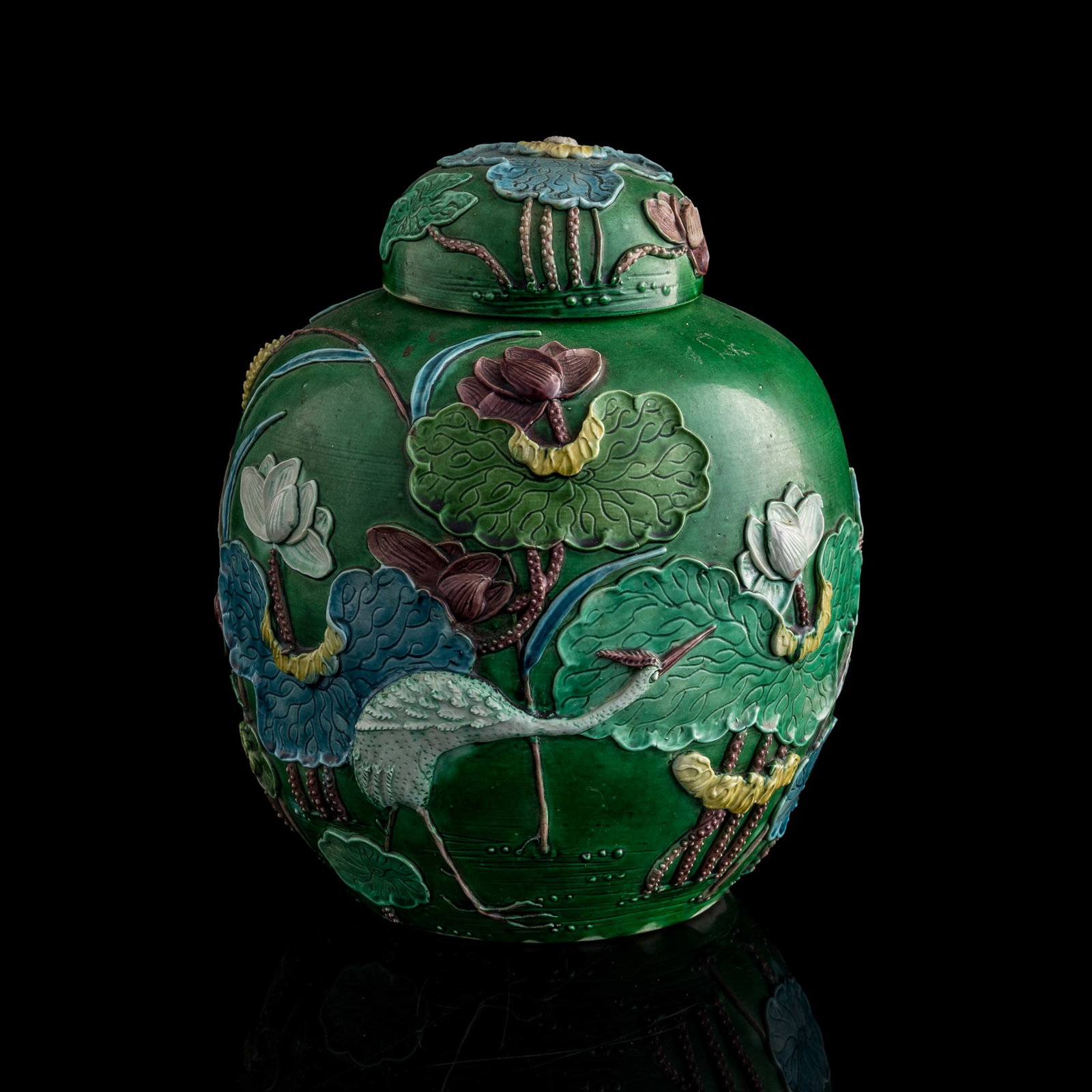 A Chinese green-ground sancai carved porcelain covered jar, Republic period (1 of 8)