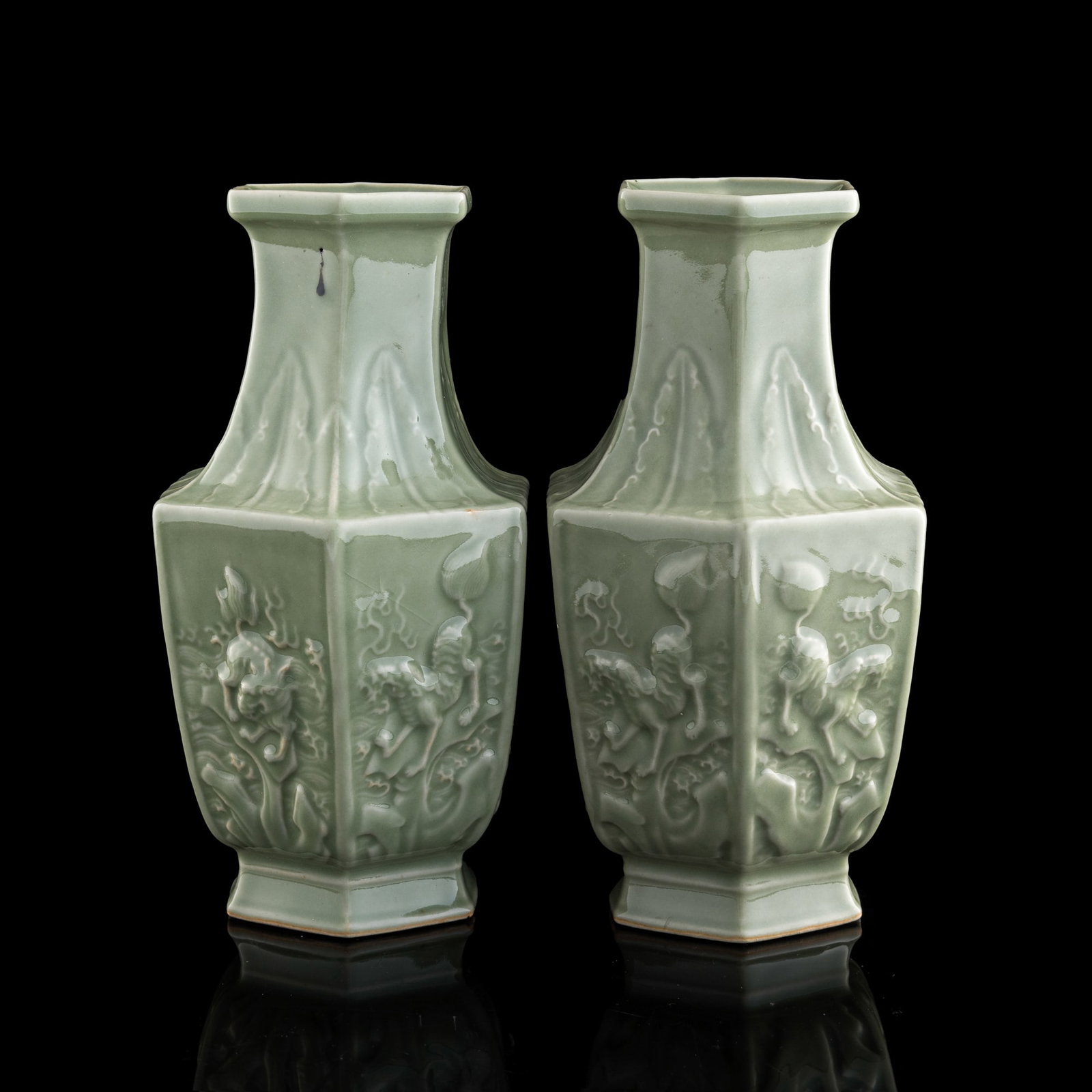 A pair of Chinese celadon-glazed 'beast' hexagonal vases, Republic period: A pair of Chinese celadon-glazed 'beast' hexagonal vases Republic period Each portraying six flaming beasts to body and with six-character mark to underside. (2). H: 11 1/4, W: 6, D: 5 3/8 in. (H: 28.