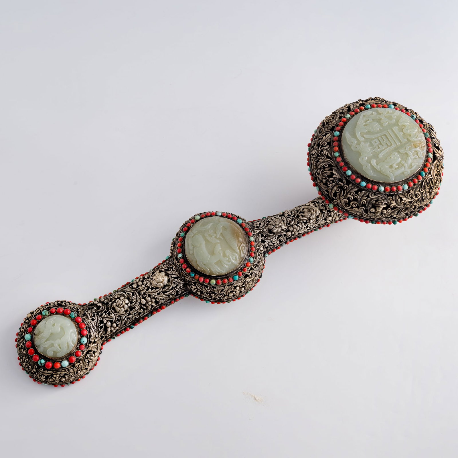 A Chinese silver-plated copper jade-inlaid ruyi scepter, 1950s-1970s: A Chinese silver-plated copper jade-inlaid ruyi scepter 1950s-1970s Sold with associated fitted box. H: 6, W: 20, D: 6 (H: 15.2, W: 50.8, D: 15.2 cm.) Weight: 1200 g (approx.) Private collection, Love