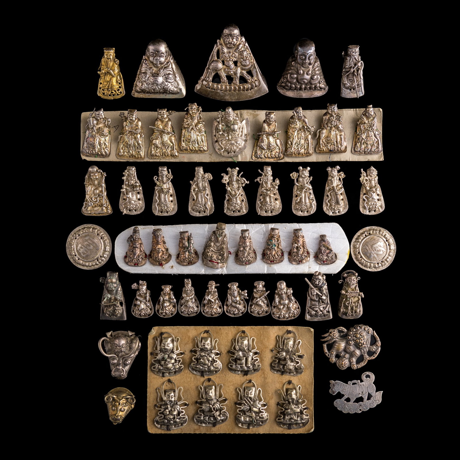 A collection of Chinese silver hat accessories, Qing dynasty: A collection of Chinese silver hat accessories Qing dynasty H: 1 1/8, W: 2 3/8, D: 2 1/4 in. (H: 2.9, W: 6, D: 5.7 cm. (largest)) Weight: 268.5 g (overall) Private collection, Lovettsville, Virginia.