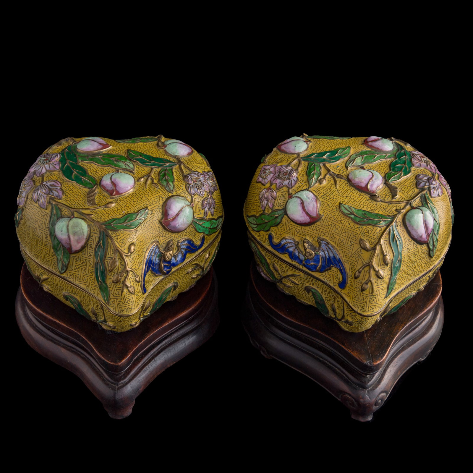 A pair of Chinese cloisonne peach-form boxes, Republic period or later: A pair of Chinese cloisonne peach-form boxes Republic period or later Sold with two associated hardwood stands. (2). H: 5 7/8, W: 8 1/4, D: 9 7/8 in. (H: 14.9, W: 21, D: 25.1 cm. (box, each)) Private 