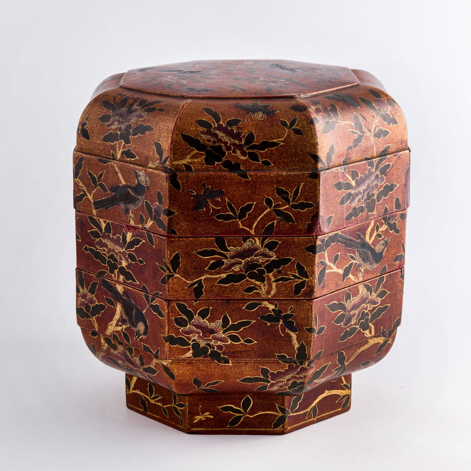 A Japanese painted wood 'flower and bird' octagonal tiered box, Meiji period: A Japanese painted wood 'flower and bird' octagonal tiered box Meiji period Sold with Bonhams auction tags. H: 11 1/4, Dia: 11 1/4 in. (H: 28.6, Dia: 28.6 cm.) Private collection, New York. Bonhams Sk