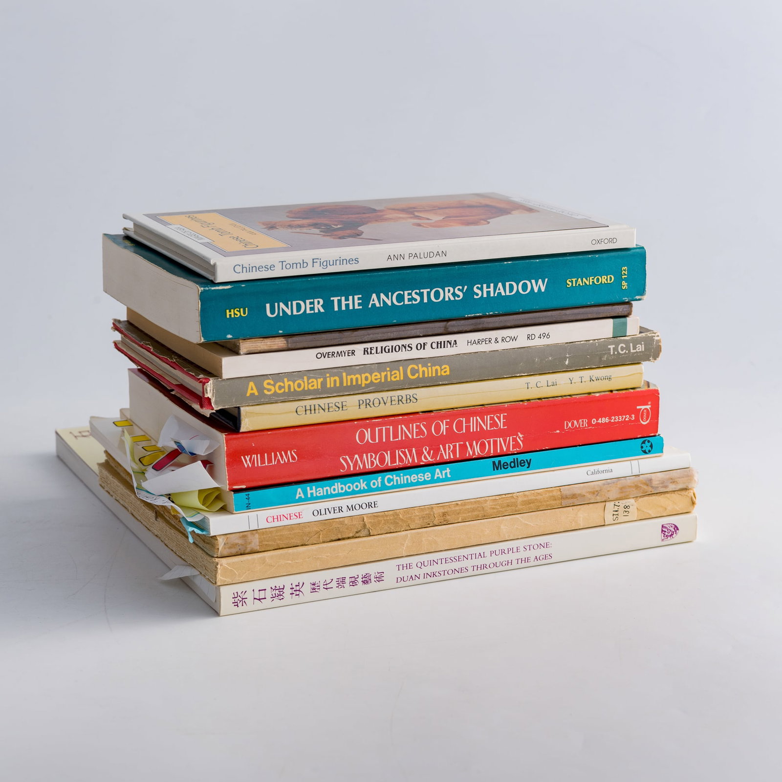 A group of twelve English-language books on Chinese art and culture: A group of twelve English-language books on Chinese art and culture consists of Chinese Tomb Figurines by Ann Paludan (1994); A Scholar in Imperial China by T. C. Lai (1970); Chinese Proverbs by T. C.
