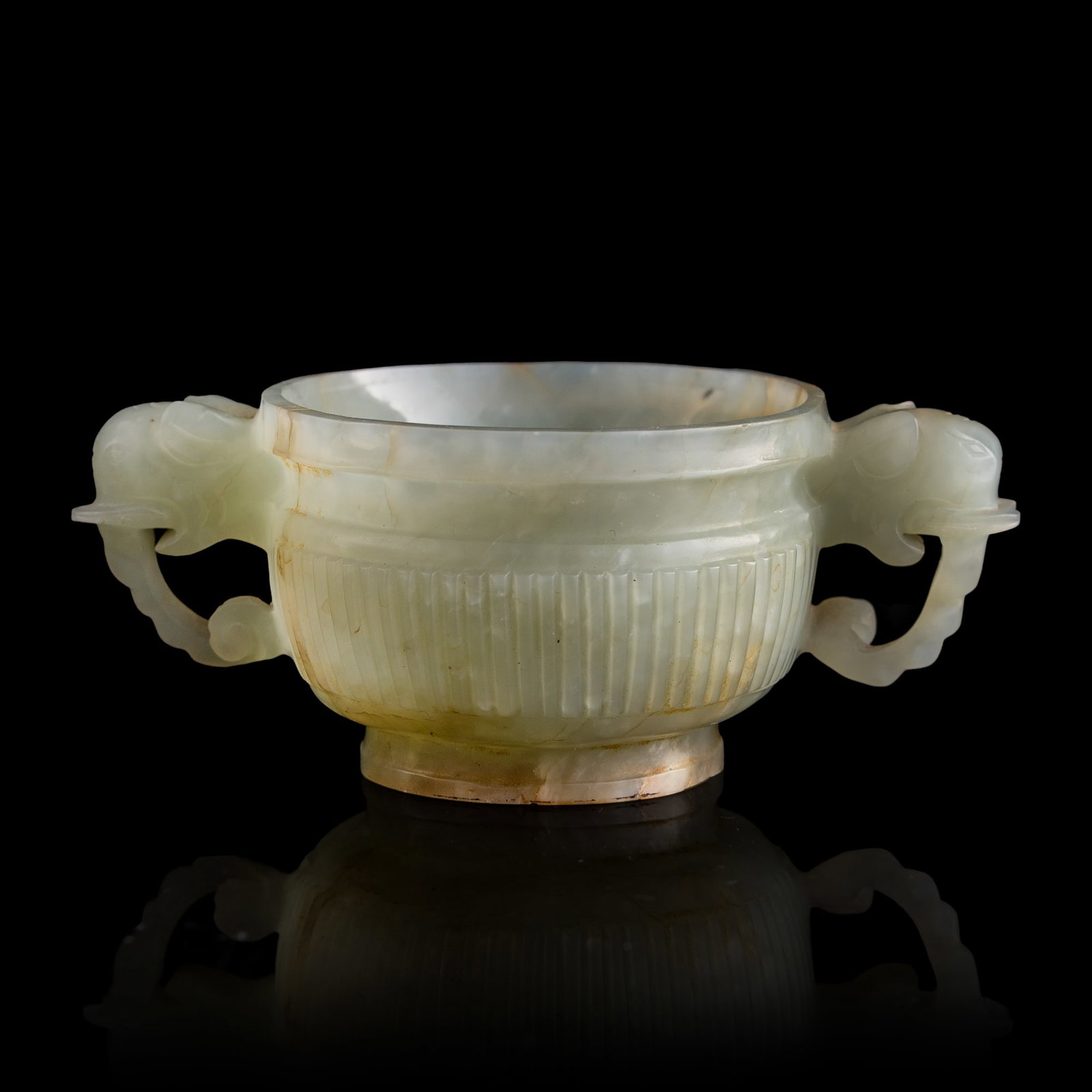 A Chinese white jade censer with elephant handles, 18th century: A Chinese white jade censer with elephant handles 18th century H: 1 3/4, W: 4 3/8, D: 2 3/4 in. (H: 4.4, W: 11.1, D: 7 cm.) From Mrs. Kiang of Solana Beach, California. Inherited from her father, Li