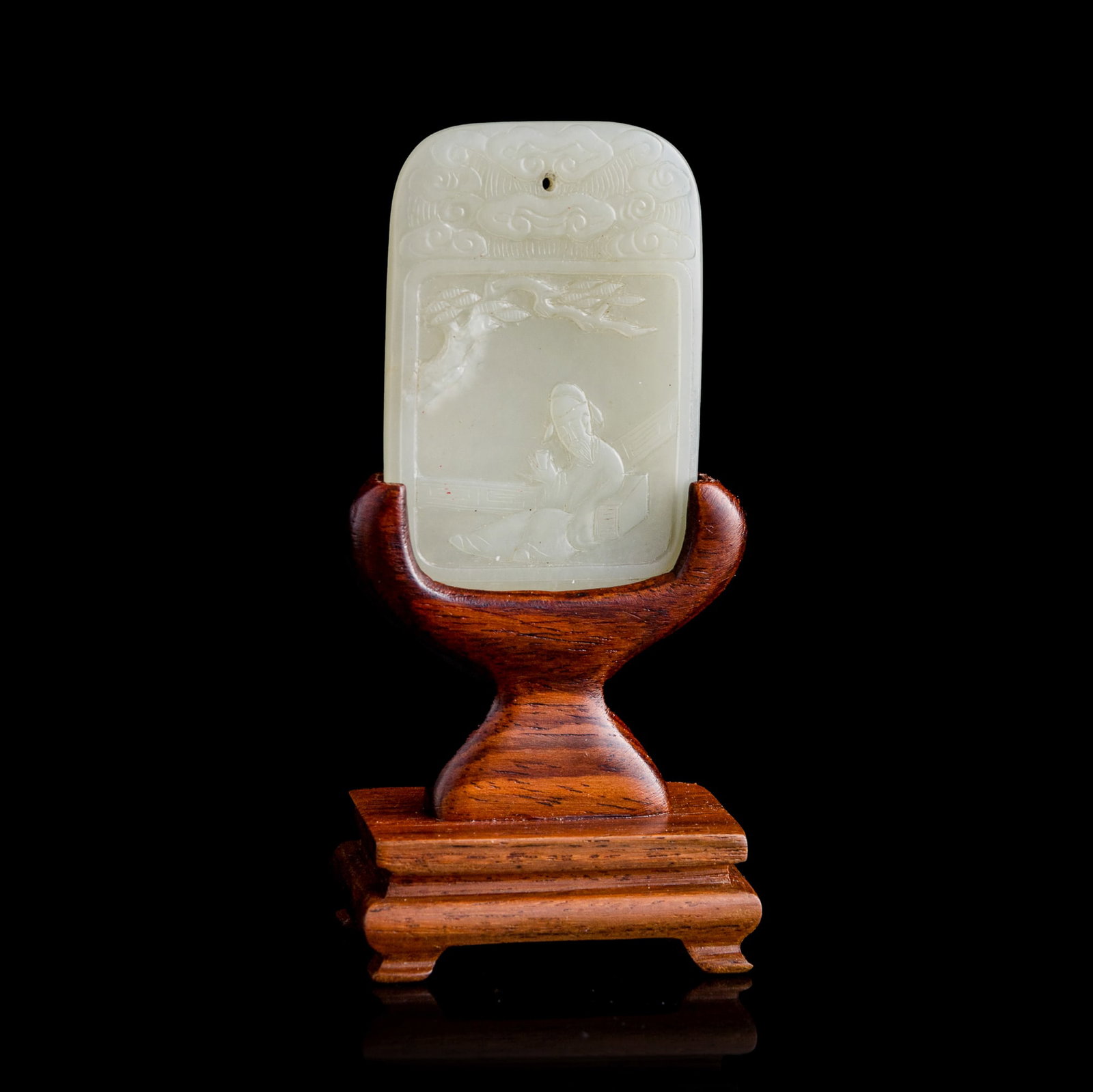 A Chinese white jade 'Li Bai' and 'inscription' plaque, 18th century: A Chinese white jade 'Li Bai' and 'inscription' plaque 18th century One side is carved in low relief with the poet Li Bai seated beneath overhanging pine branches, holding a wine cup to his lips. The