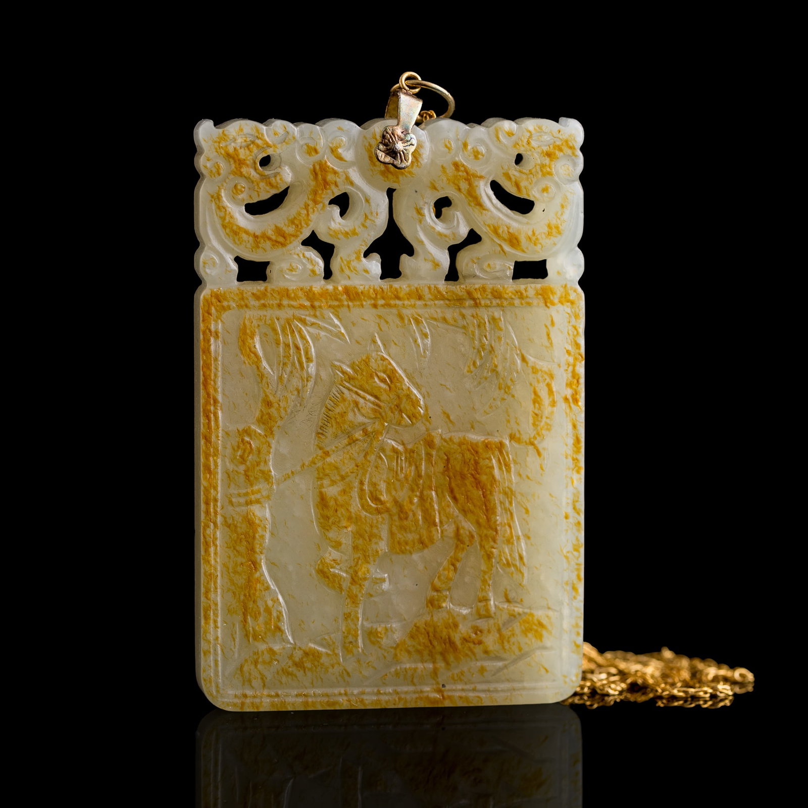 A Chinese white jade 'horse' and 'inscription' plaque, 18th/19th century: A Chinese white jade 'horse' and 'inscription' plaque 18th/19th century One side contains an image of a horse beneath a willow tree surmounted by a pair of dragons carved into an area of russet skin; 