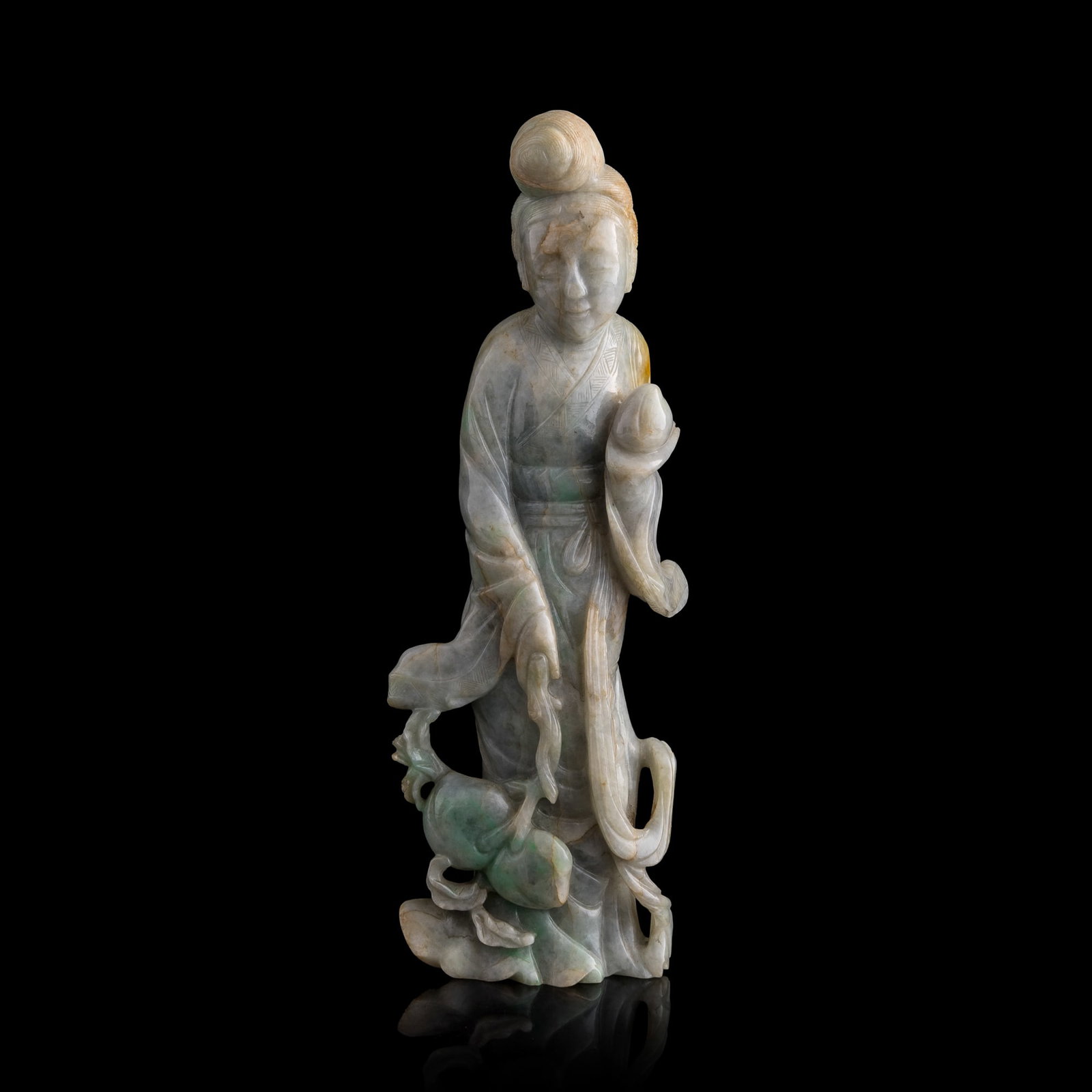 A Chinese jadeite lady figure, 19th century: A Chinese jadeite lady figure 19th century depicts a lady with flowing robes holding up a lingzhi fungus with peaches piled near her feet; possibly Magu H: 9, W: 3, D: 1 3/4 in. (H: 22.9, W: 7.6, D: 4