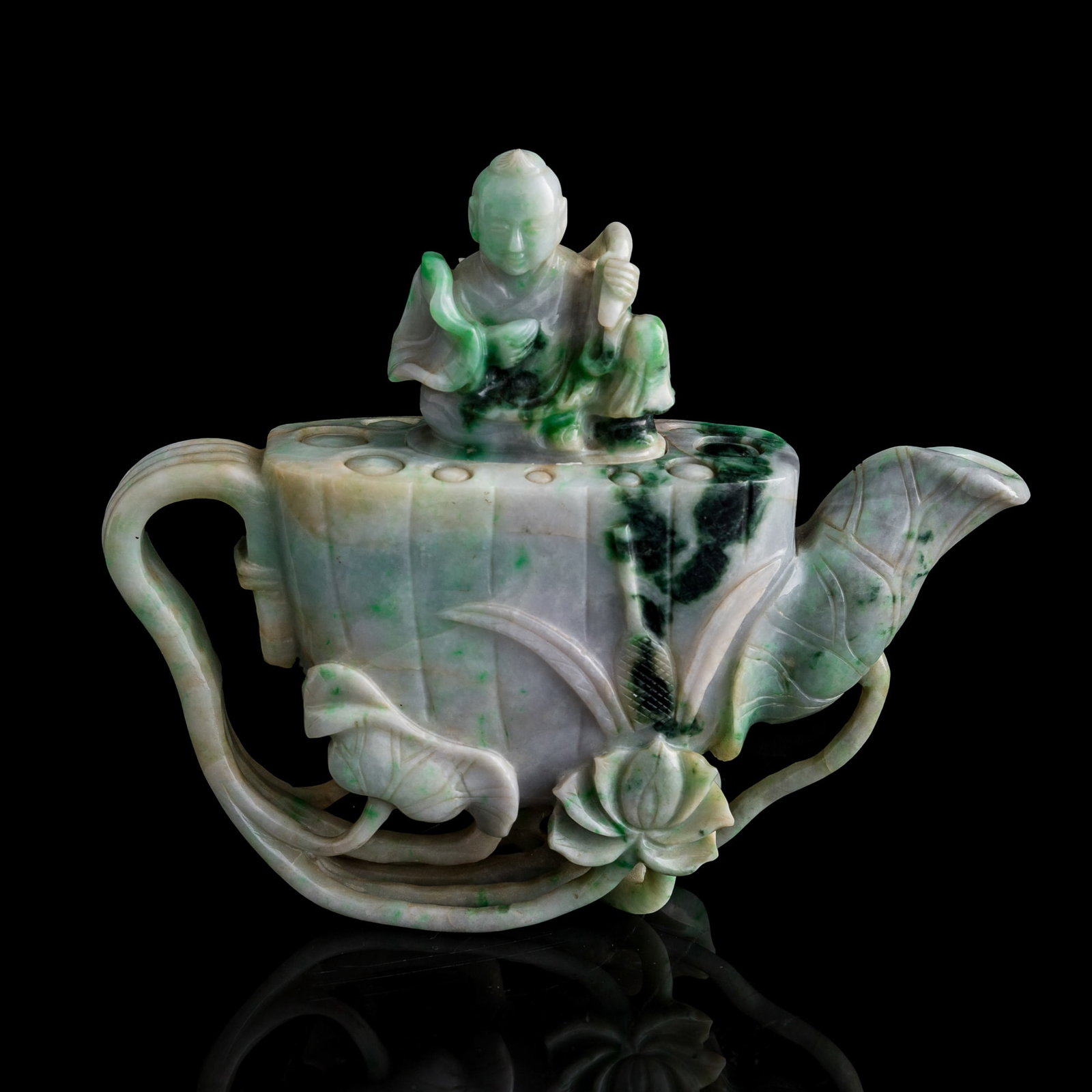 A Chinese jadeite lotus-form teapot with boy finial, Qing dynasty: A Chinese jadeite lotus-form teapot with boy finial Qing dynasty H: 6 1/2, W: 7 1/2, D: 2 in. (H: 16.5, W: 19, D: 5.1 cm.) Private collection, Southern California.