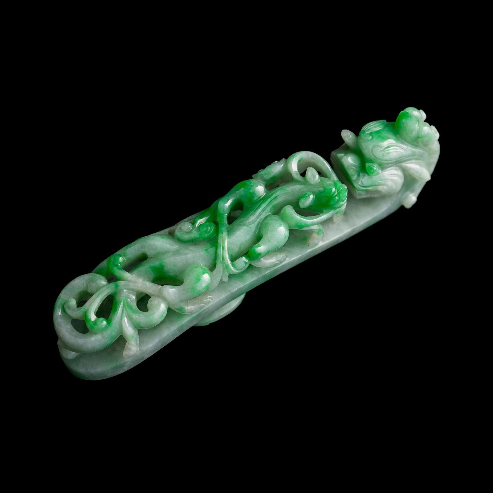 A Chinese jadeite dragon belt hook, Qing dynasty: A Chinese jadeite dragon belt hook Qing dynasty H: 1, W: 3/4, D: 3 3/4 in. (H: 2.5, W: 1.9, D: 9.5 cm.) From Mrs. Hillebrand of Chicago, Illinois. Her father-in-law acquired these items in China and H
