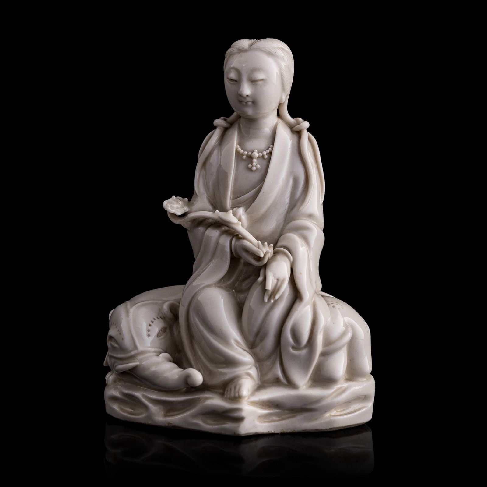 A Chinese Dehua seated figure of Samantabhadra, 17th century: A Chinese Dehua seated figure of Samantabhadra 17th century Depicted sitting alongside an elephant with a ruyi scepter in her hand. H: 4 7/8, W: 3 1/2, D: 2 1/2 in. (H: 12.4, W: 8.9, D: 6.4 cm.) From 