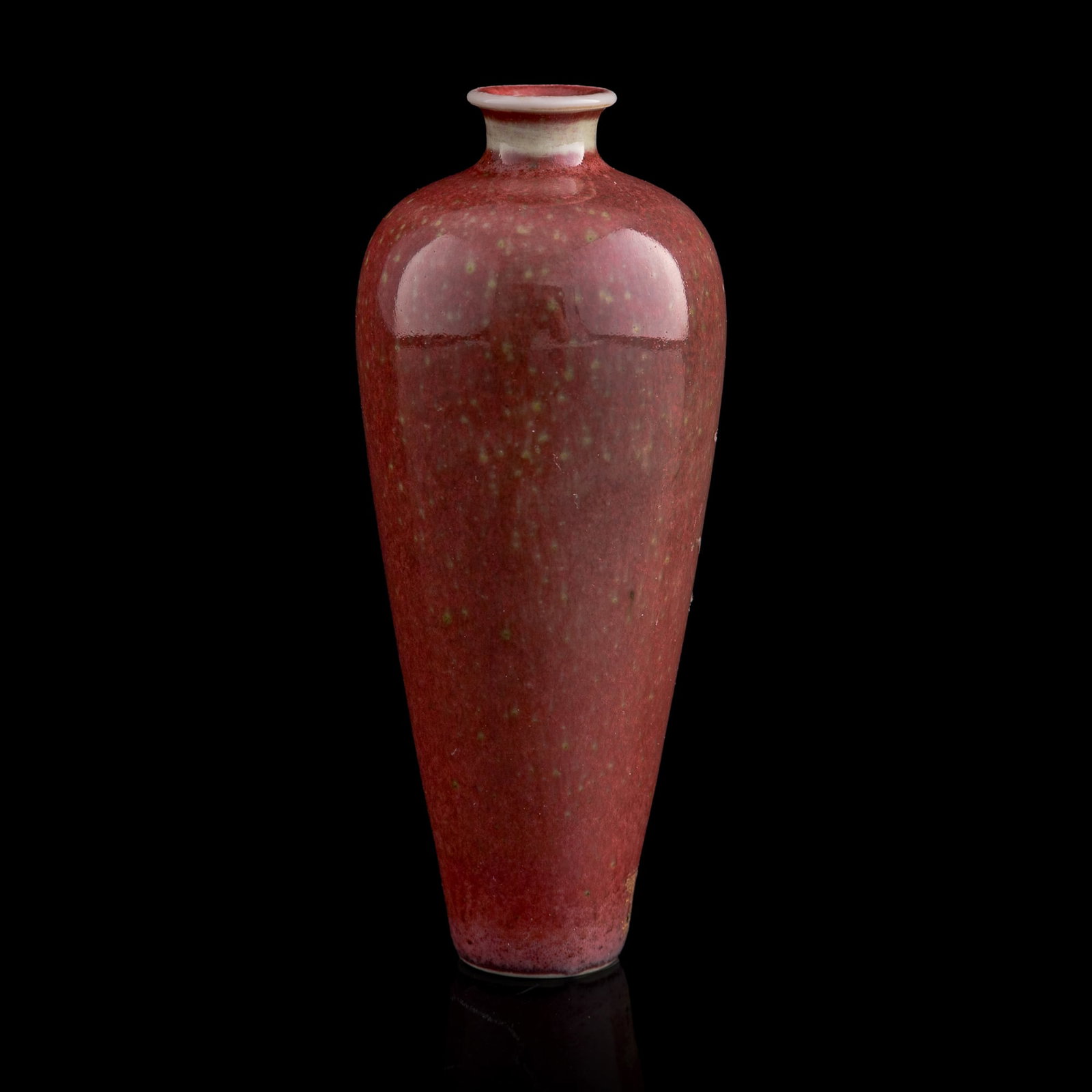 A Chinese peachbloom-glazed meiping vase, Qing dynasty: A Chinese peachbloom-glazed meiping vase Qing dynasty With six-character mark to underside. Sold with fitted box. H: 4 1/8, Dia: 1 3/4 in. (H: 10.8, Dia: 4.4 cm.) From Mr. Kwok of Vancouver, Canada. I