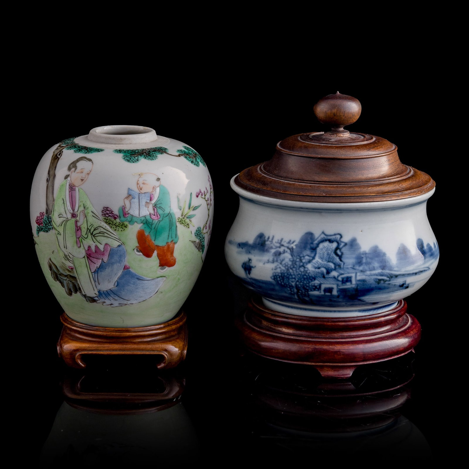 A Chinese famille rose 'figural' jar and a blue and white 'landscape' censer, 18th century: A Chinese famille rose 'figural' jar and a blue and white 'landscape' censer 18th century Each with wooden stands, censer with wooden cover (2). H: 4, Dia: 3 3/4 in. (H: 10.2, Dia: 9.5 cm. (jar)) H: 2