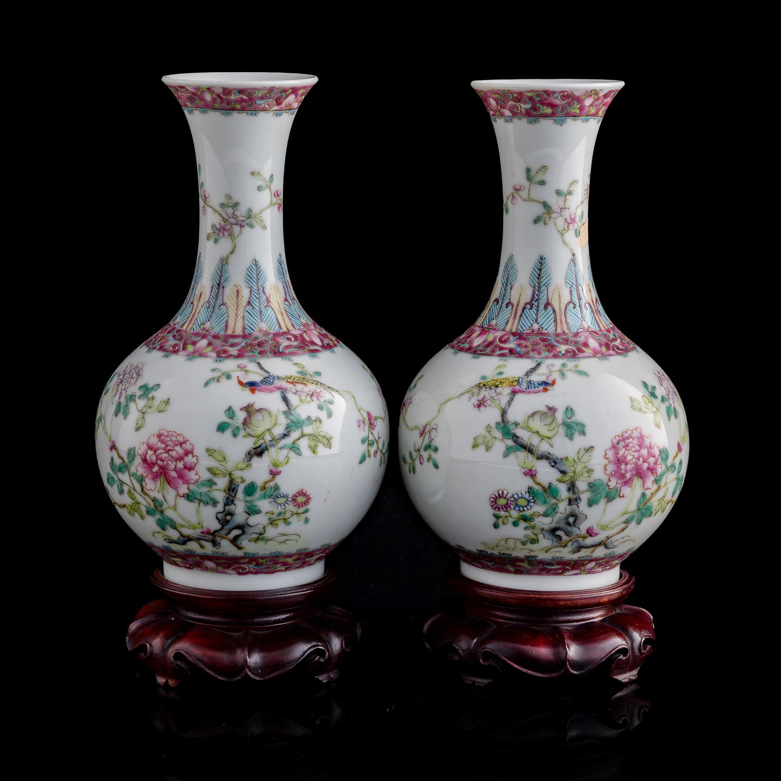 A pair of Chinese famille rose 'birds and flowers' shangping vases, Republic period: A pair of Chinese famille rose 'birds and flowers' shangping vases Republic period Each with four-character mark to underside. Sold with two associated hardwood stands. (2). H: 8 5/8, Dia: 4 7/8 in. (