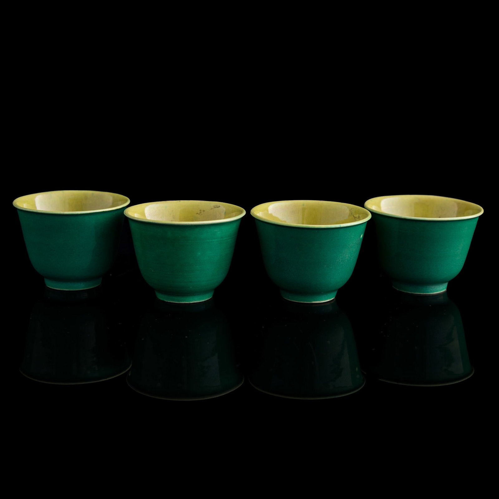 A set of four Chinese green-glazed cups, 18th/19th century: A set of four Chinese green-glazed cups 18th/19th century H: 1 1/2, Dia: 2 in. (H: 3.8, Dia: 5.1 cm. (each)) Private collection, New Jersey. Click here for high re