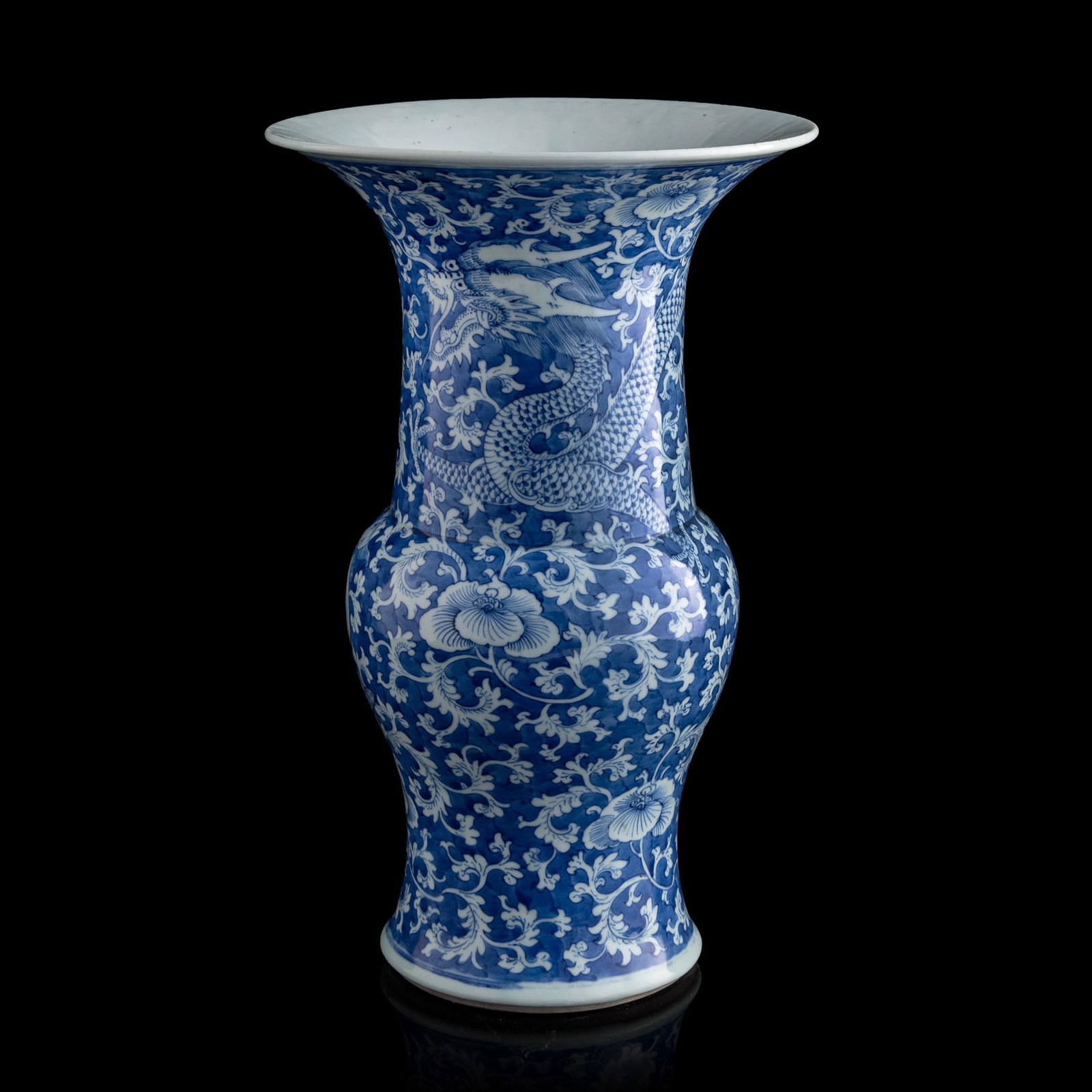 A Chinese blue and white floral gu vase, early 19th century: A Chinese blue and white floral gu vase early 19th century with four-character mark to underside H: 15 5/8, Dia: 9 1/2 in. (H: 39.7, Dia: 24.1 cm.) From an estate in San Diego, California.