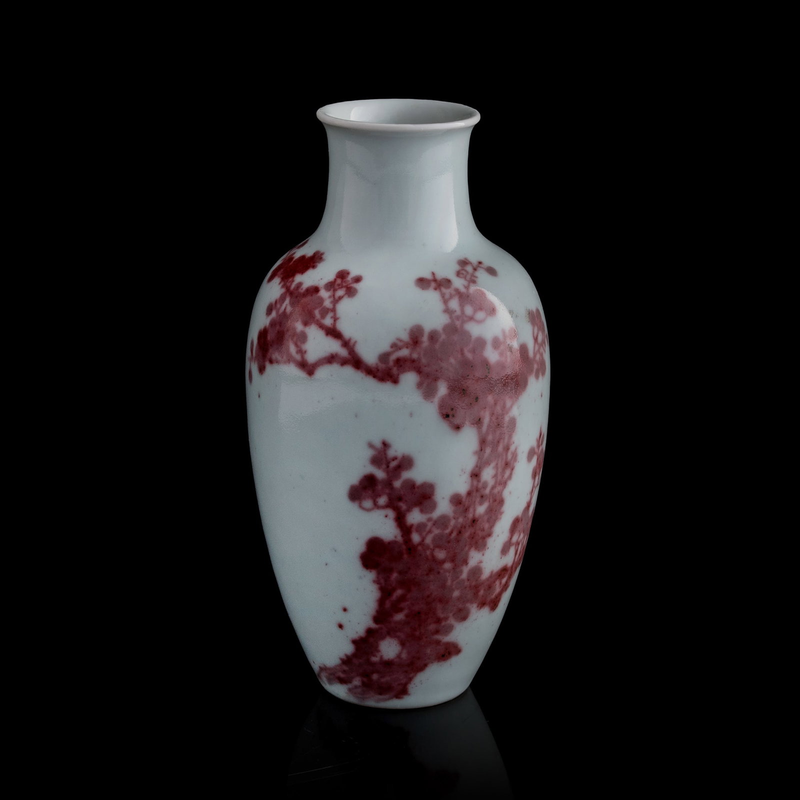 A Chinese copper-red-underglazed 'plum blossom' vase, 19th century: A Chinese copper-red-underglazed 'plum blossom' vase 19th century H: 6 7/8, Dia: 3 1/2 in. (H: 17.5, Dia: 8.9 cm.) From Mrs. Foo of Vancouver, Canada. Inherited from her parents-in-law; the item was a