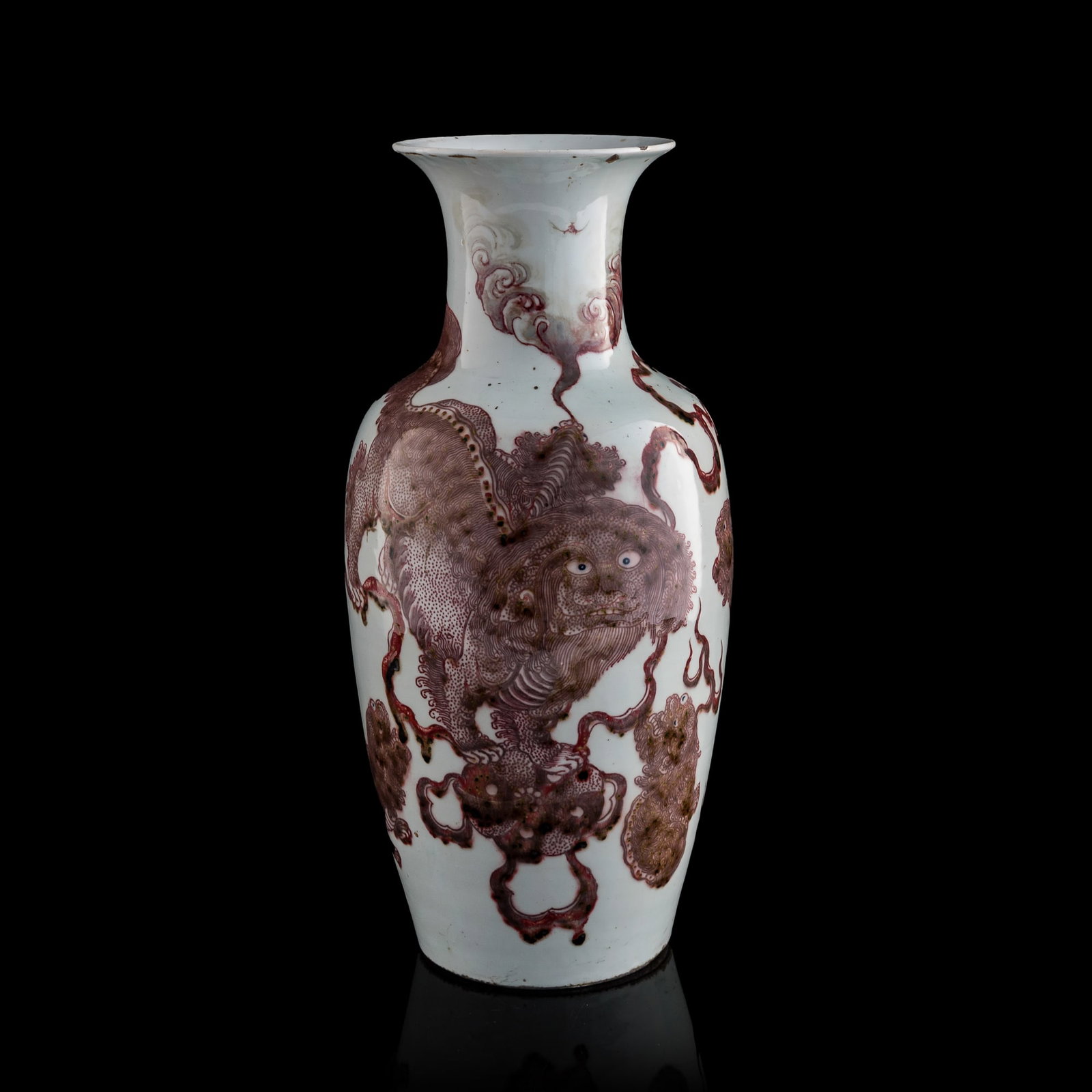 A Chinese copper-red-underglazed 'lion and cub' vase, 19th century: A Chinese copper-red-underglazed 'lion and cub' vase 19th century With four-character mark to underside. H: 18 1/4, Dia: 8 3/4 in. (H: 46.4, Dia: 22.2 cm.) From Mrs. Foo of Vancouver, Canada. Inherite