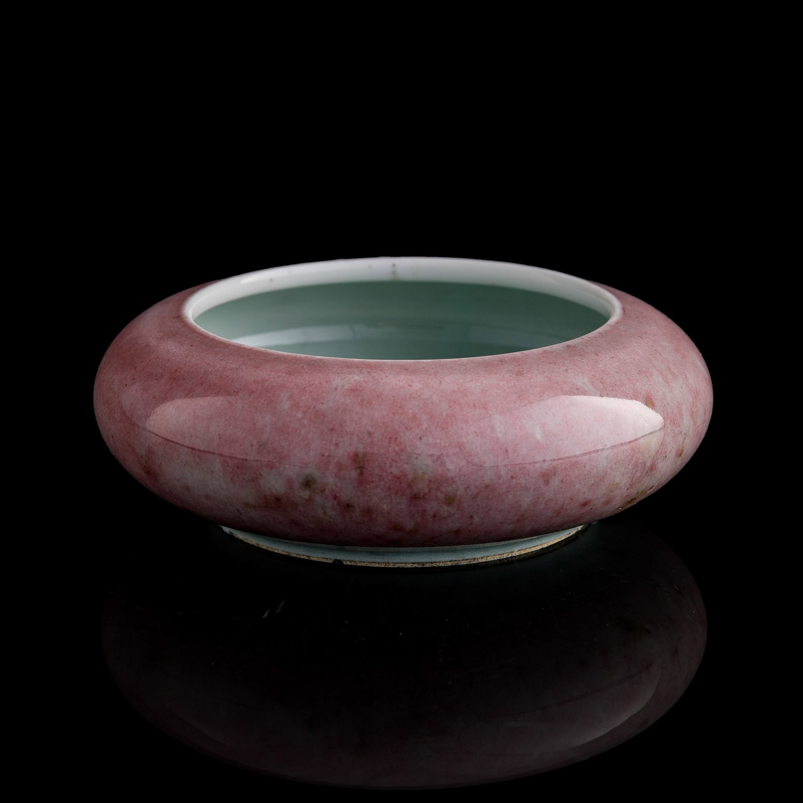 A Chinese peachbloom-glazed tangluo washer, Qing dynasty: A Chinese peachbloom-glazed tangluo washer Qing dynasty With six-character mark to underside. Accompanied by a digital copy of a 1981 receipt from China Products Co., Hong Kong. The item number K6491 