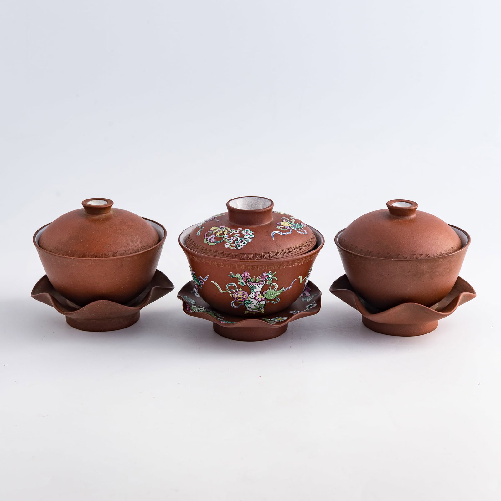 Three Chinese Yixing zisha covered tea bowls, Qing dynasty/Republic period: Three Chinese Yixing zisha covered tea bowls Qing dynasty/Republic period H: 3 7/8, Dia: 4 in. (H: 9.8, Dia: 10.2 cm. (largest)) From Mrs. Cheng of Daly City, California. The items were collected in H