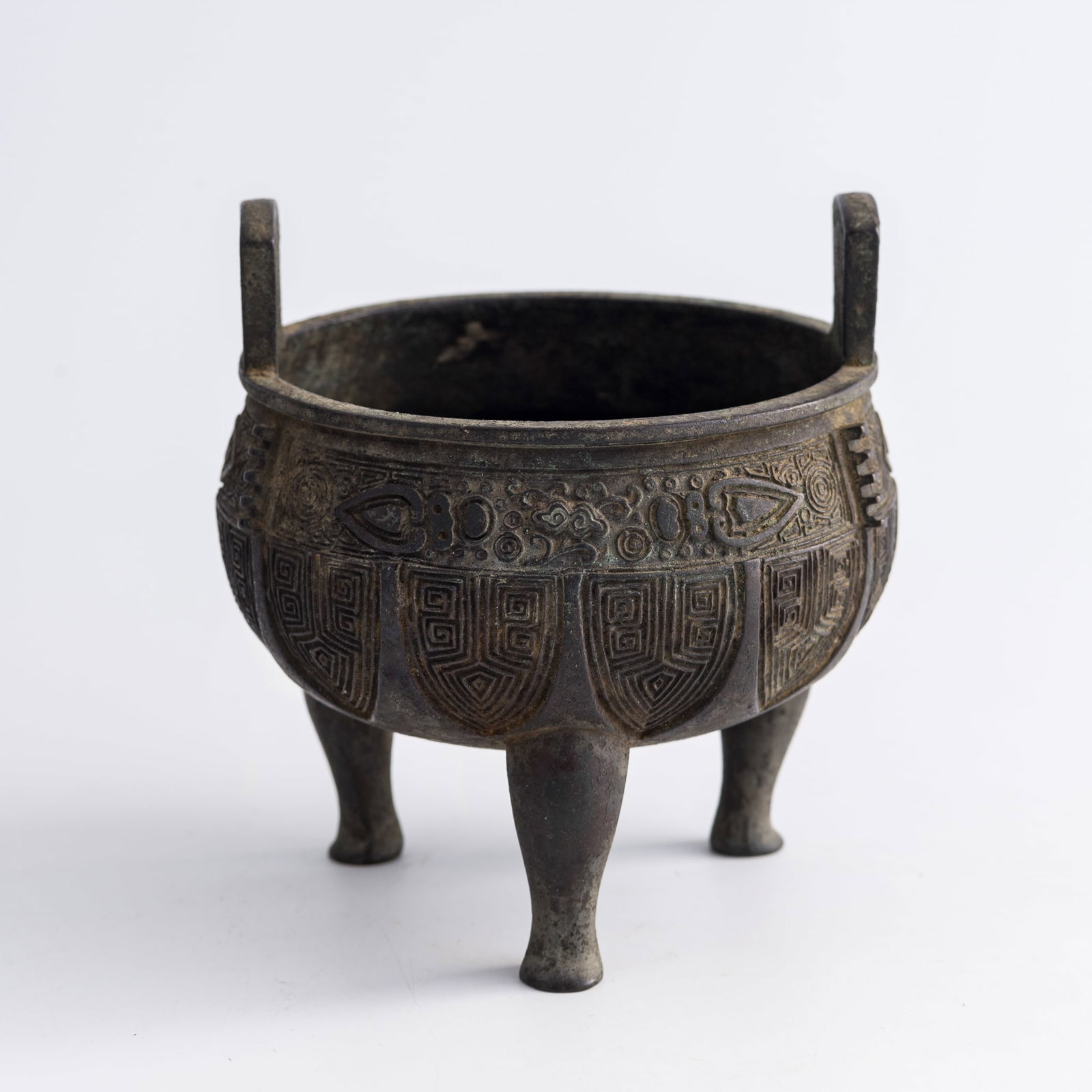 A Chinese bronze tripod round ding, Ming dynasty (1 of 7)