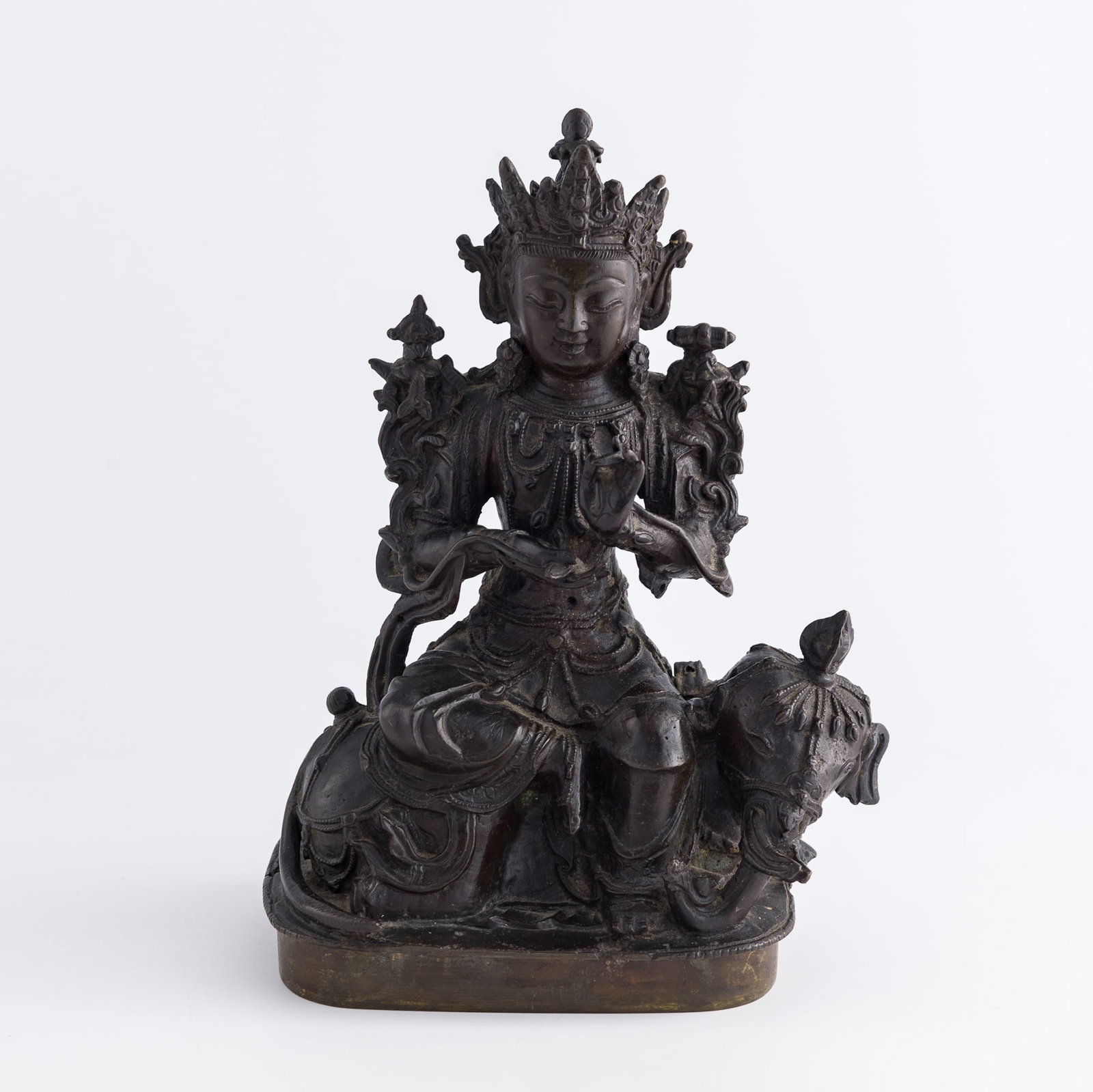 A Chinese bronze figure of Samantabhadra, Ming dynasty: A Chinese bronze figure of Samantabhadra Ming dynasty With name 'SAMANTABHADRA' written on sticker on foot H: 9 1/4, W: 6 1/2, D: 4 1/4 in. (H: 23.5, W: 16.5, D: 10.8 cm.) Weight: 2529 g From Mrs. Dow