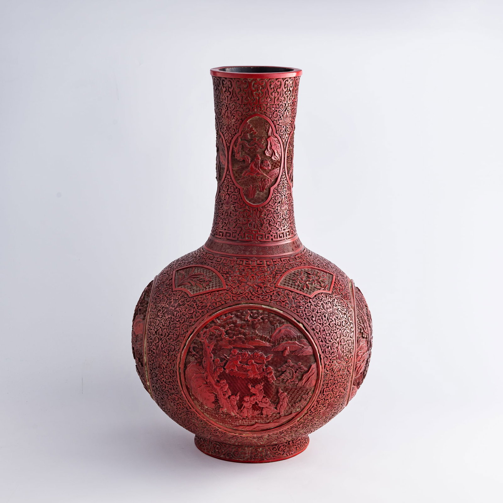 A Chinese cinnabar 'children playing' tianqiu vase, early 19th century: A Chinese cinnabar 'children playing' tianqiu vase early 19th century H: 23 3/4, Dia: 14 1/2 in. (H: 60.3, Dia: 36.8 cm.) Private collection, Windermere, Florida.