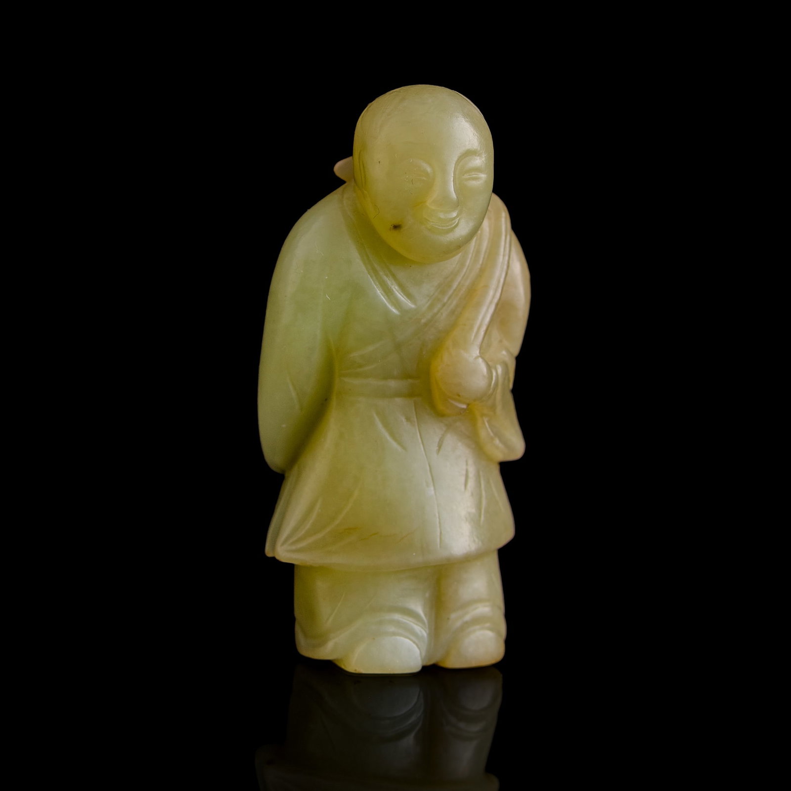 A Chinese yellow jade carving of boy holding lotus, Ming dynasty (1 of 7)