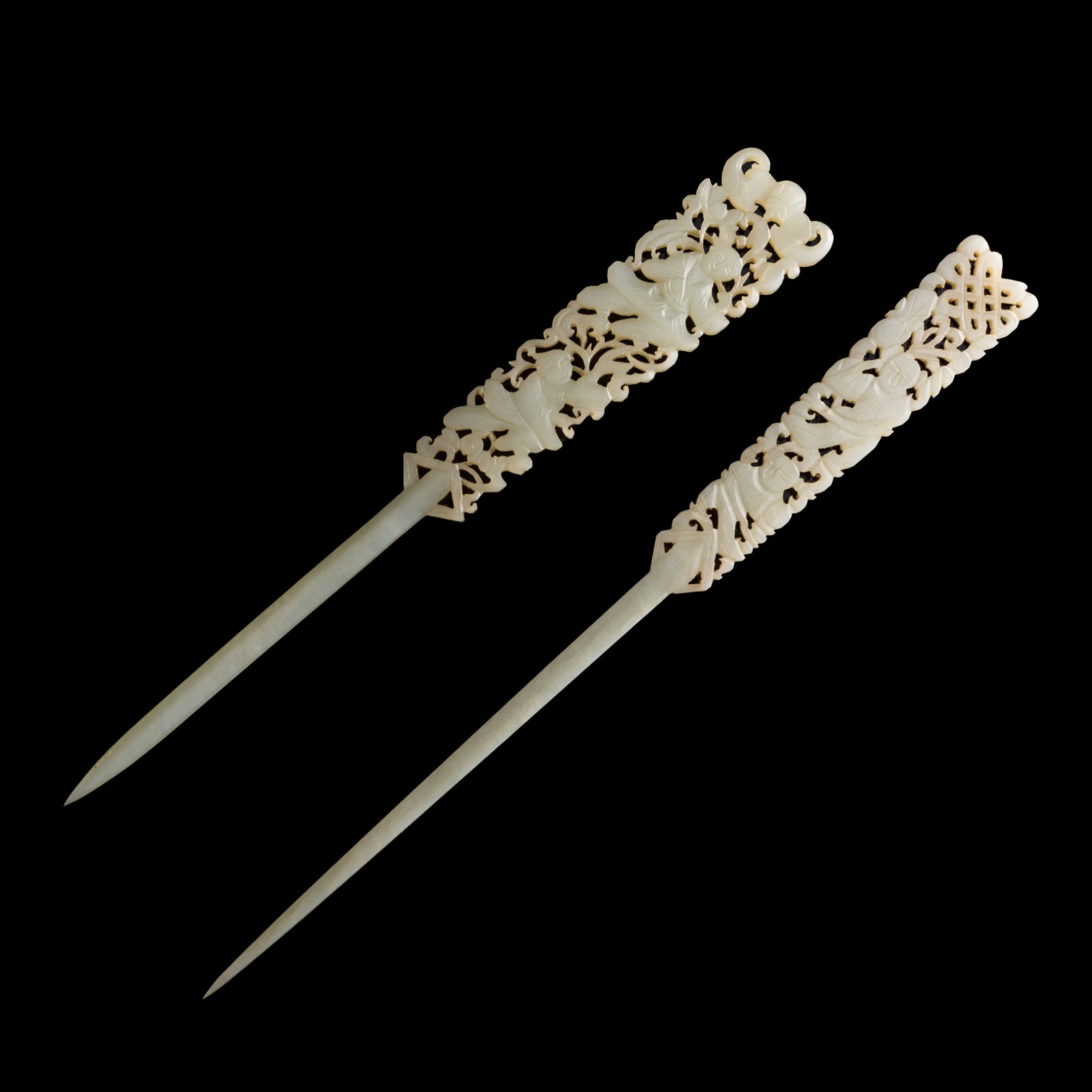 Two Chinese white jade hairpins, 18th century: Two Chinese white jade hairpins 18th century Sold with associated velvet box. (2). H: 7 3/8, W: 3/4, D: 1/8 in. (H: 18.7, W: 1.9, D: 0.3 cm. (largest)) Private collection, Arlington, Virginia.