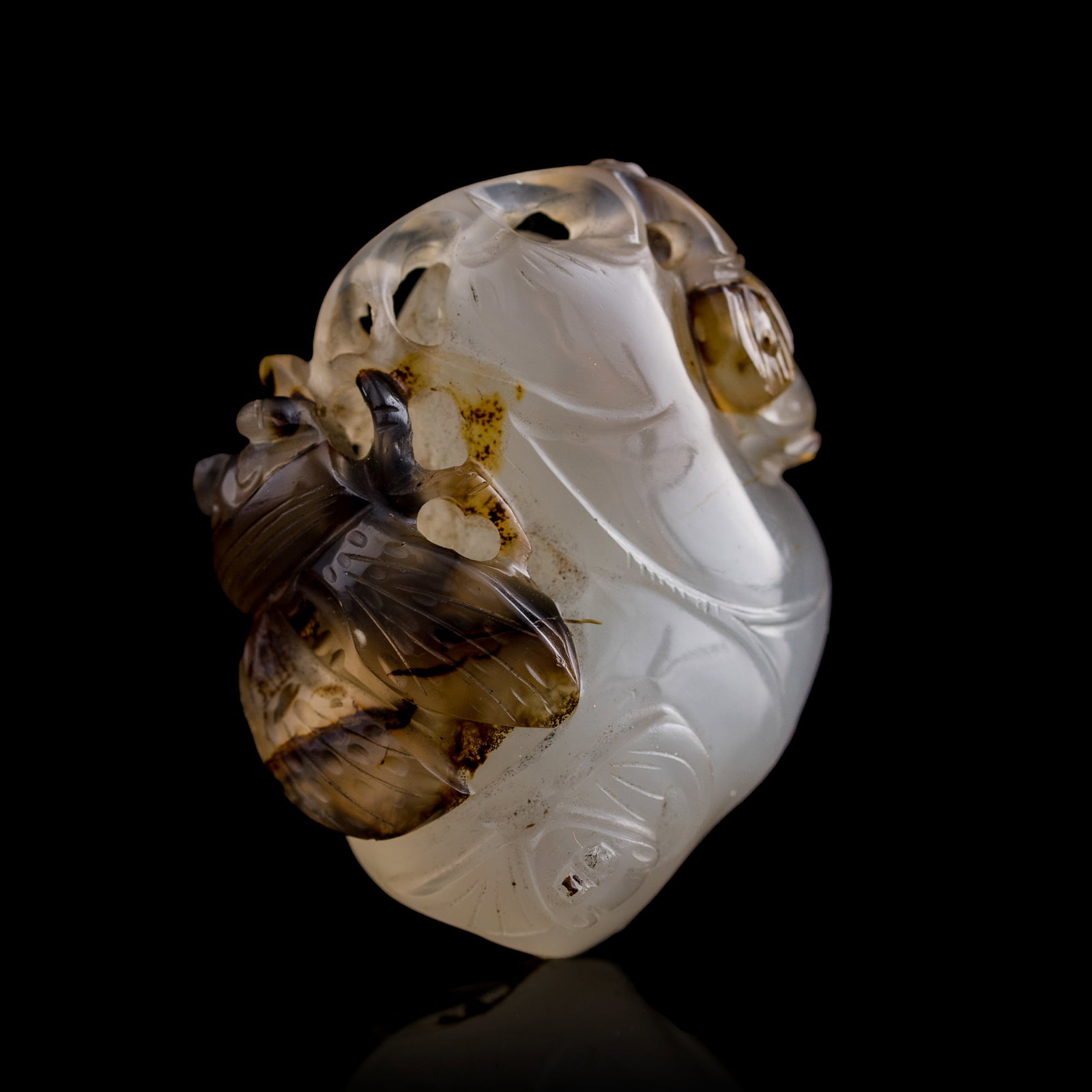 A Chinese agate 'cicada' pendant, early 19th century: A Chinese agate 'cicada' pendant early 19th century H: 1 3/4, W: 1 1/2, D: 1 in. (H: 4.4, W: 3.8, D: 2.5 cm.) Private collection, Florida. Click here for high reso