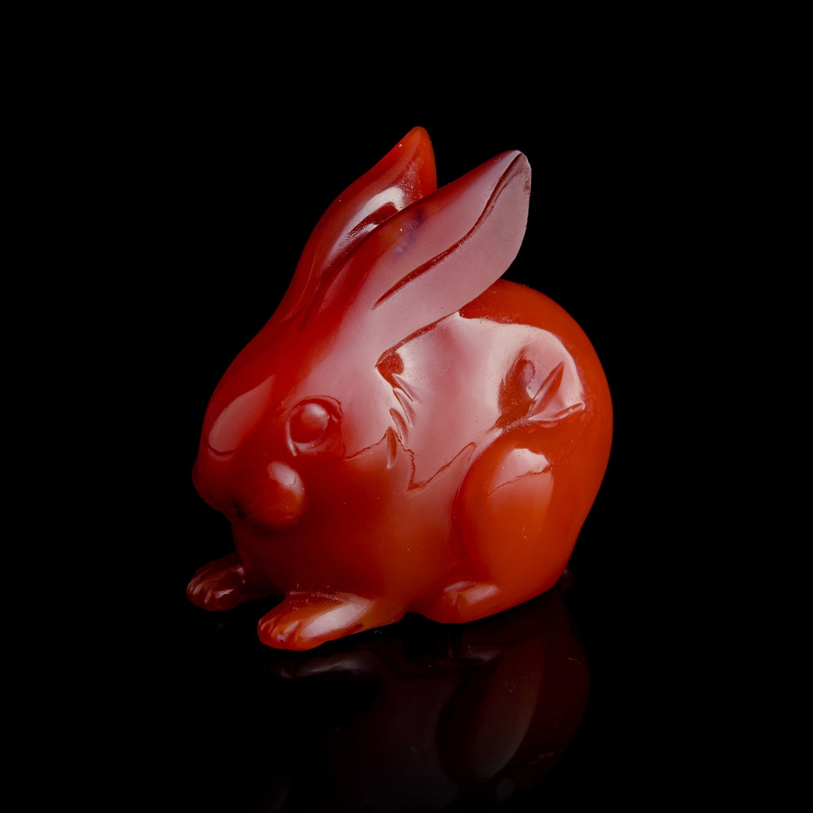 A Chinese agate carving of a rabbit, 18th century: A Chinese agate carving of a rabbit 18th century H: 2 1/8, W: 2 3/8, D: 1 3/8 in. (H: 5.4, W: 6, D: 3.5 cm.) Private collection, Houston, Texas. Click here for hig