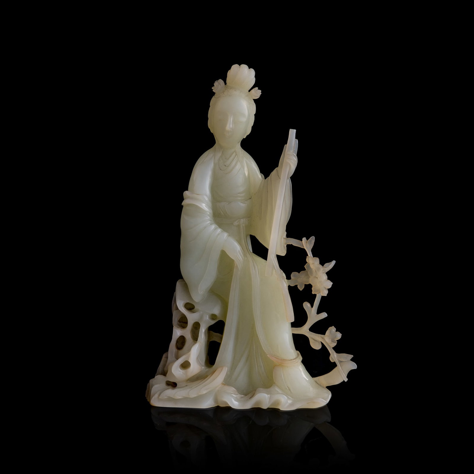 A Chinese white jade carving of Lin Daiyu, 19th century: A Chinese white jade carving of Lin Daiyu 19th century Depicting Lin Daiyu holding a garden hoe, indicating that she is burying fallen flower blossoms as portrayed in a famous scene in Dream of the Re