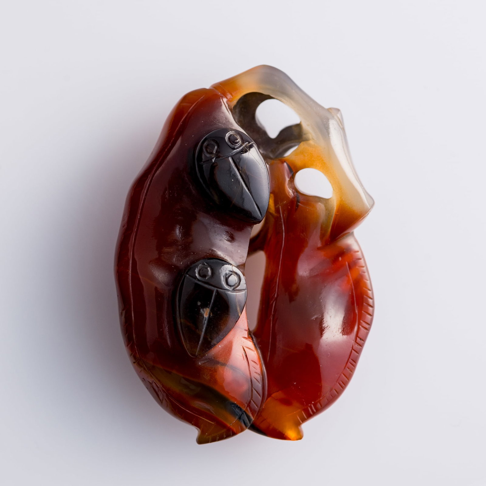 A Chinese carved agate bean pod-form pendant, 18th century: A Chinese carved agate bean pod-form pendant 18th century H: 1 7/8, W: 1 1/4, D: 5/8 in. (H: 4.8, W: 3.2, D: 1.6 cm.) Private collection, Arlington, Virginia. Clic