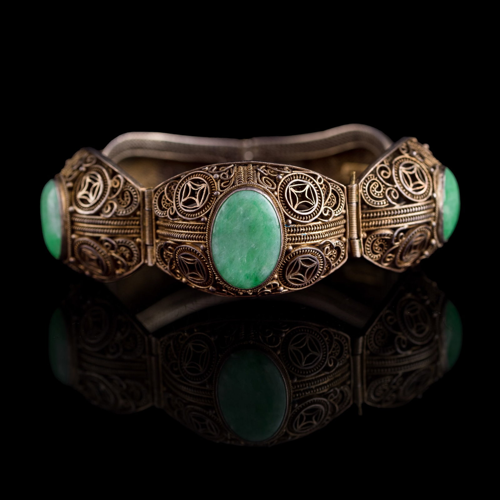 A Chinese silver bracelet set with jadeite, Republic period (1 of 8)