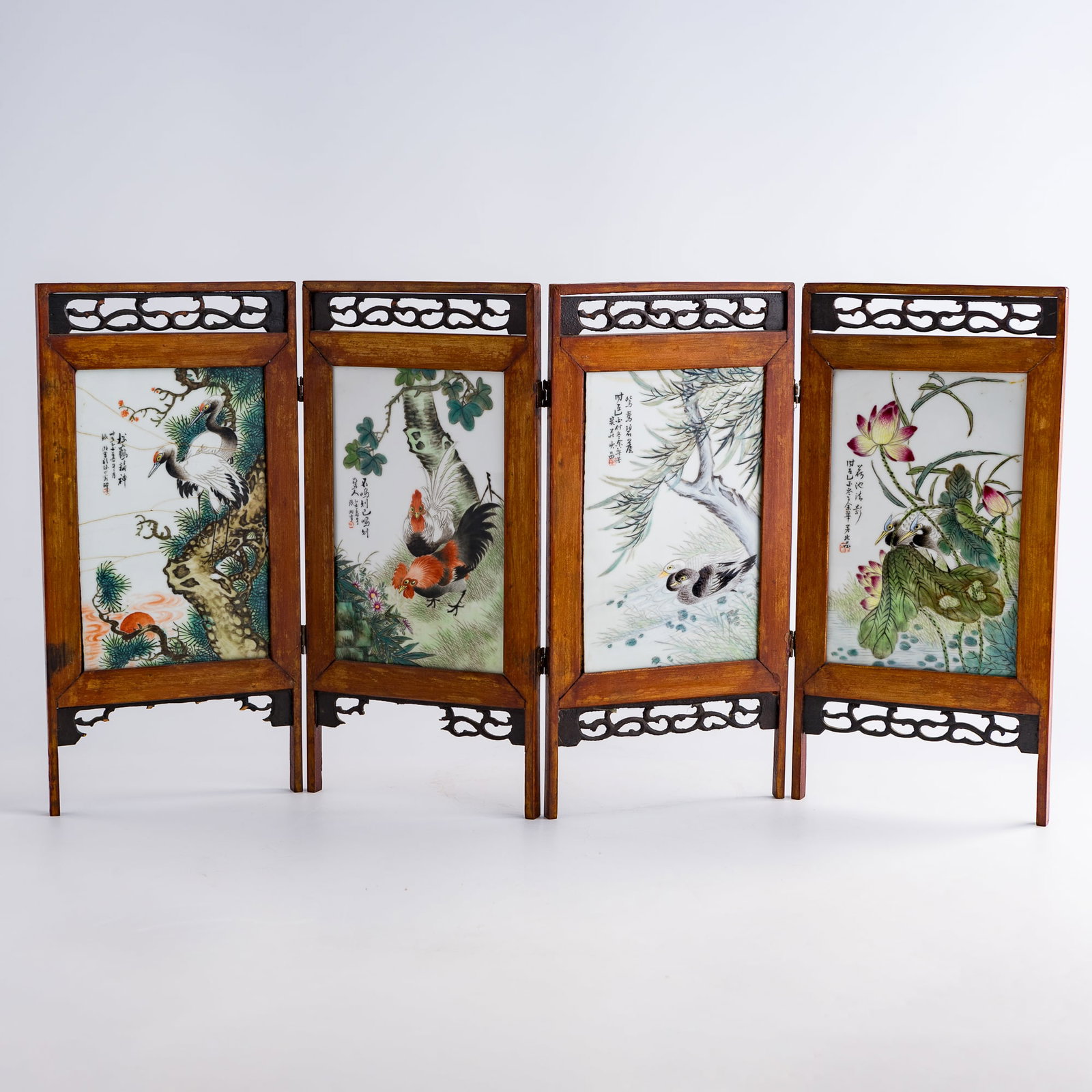 A Chinese four-panel famille rose porcelain plaque table screen, Republic period: A Chinese four-panel famille rose porcelain plaque table screen Republic period Each plaque: H: 7 3/8, W: 4 3/4 in. (H: 18.7, W: 12.1 cm.) Each panel: H: 13 1/8, W: 6 1/2 in. (H: 33.3, W: 16.5 cm.) Pr