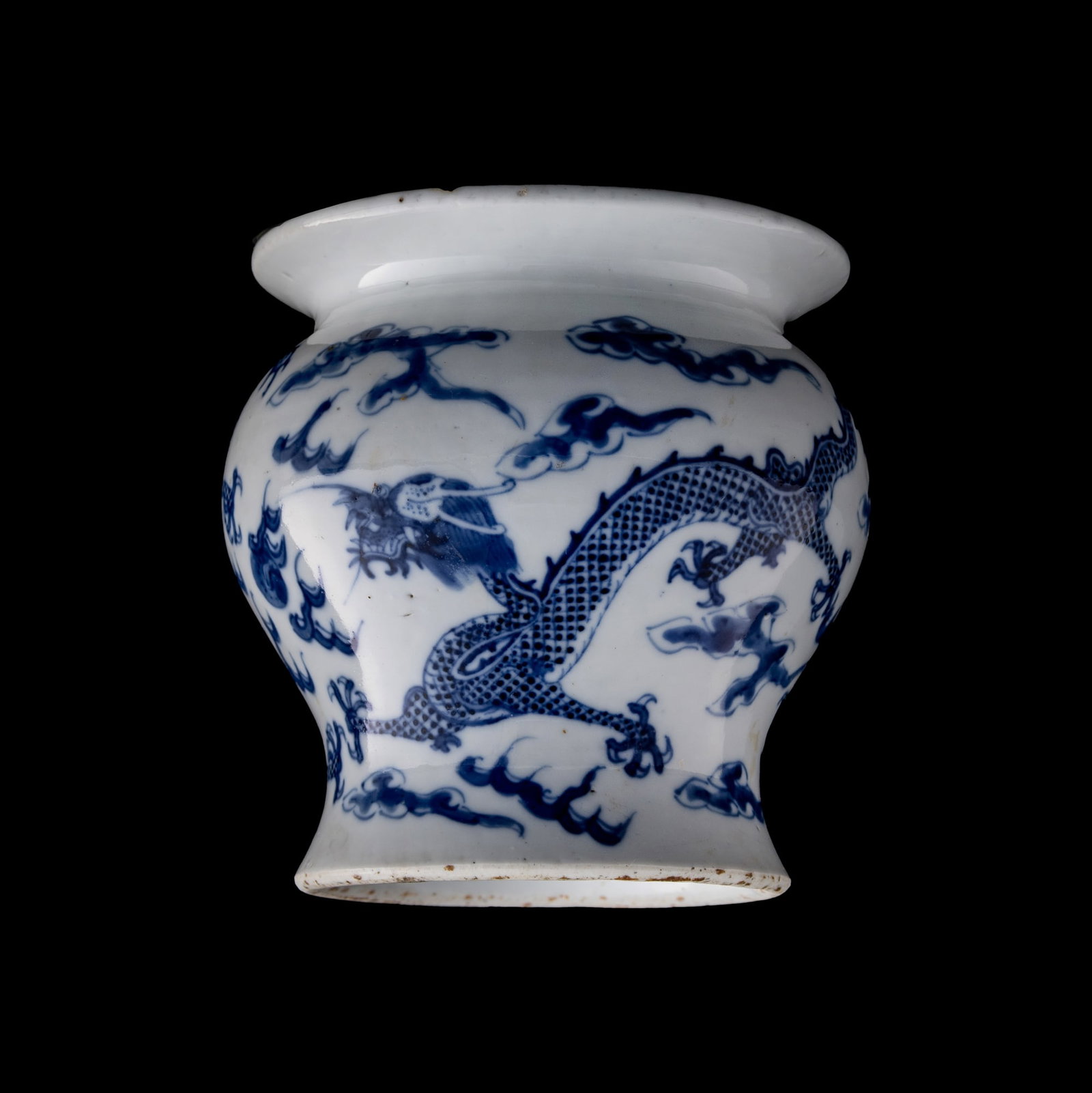 A Chinese blue and white 'dragon' base, 19th century: A Chinese blue and white 'dragon' base 19th century H: 4 1/2, Dia: 4 3/8 in. (H: 11.4, Dia: 11.1 cm.) Private collection, Laurel, Maryland. Click here for high res