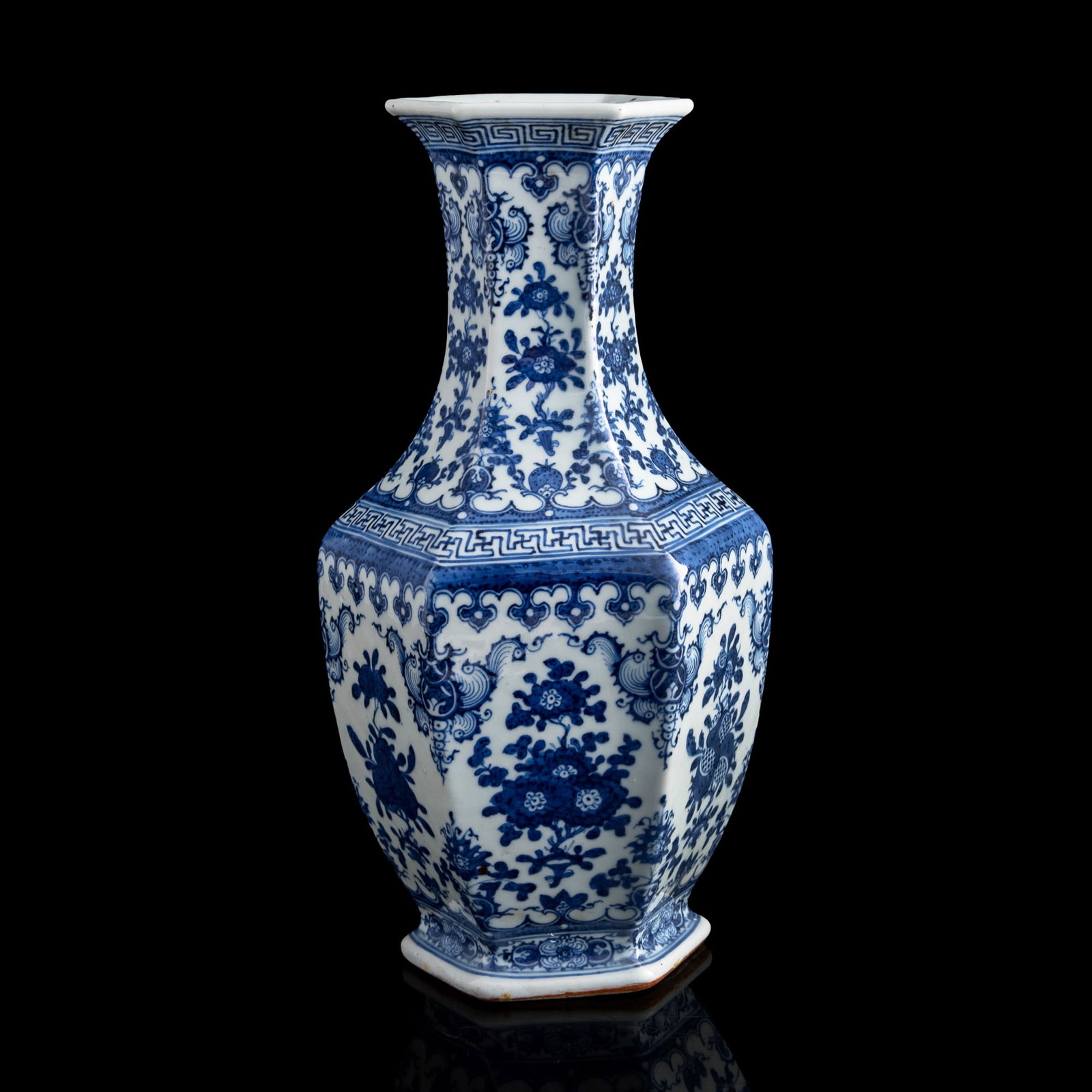 A Chinese blue and white hexagonal floral vase, 19th century: A Chinese blue and white hexagonal floral vase 19th century with six-character mark to underside H: 13 3/4, W: 6 1/2, D: 6 1/2 in. (H: 34.9, W: 16.5, D: 16.5 cm.) From an estate in San Diego, Californ