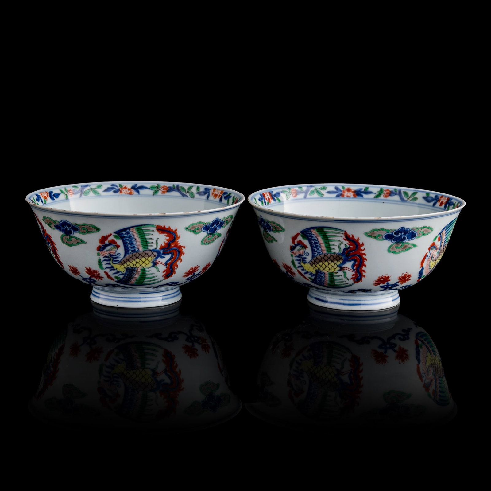 A pair of Chinese blue and wucai 'phoenix' bowls, Kangxi period, Qing dynasty (1 of 15)