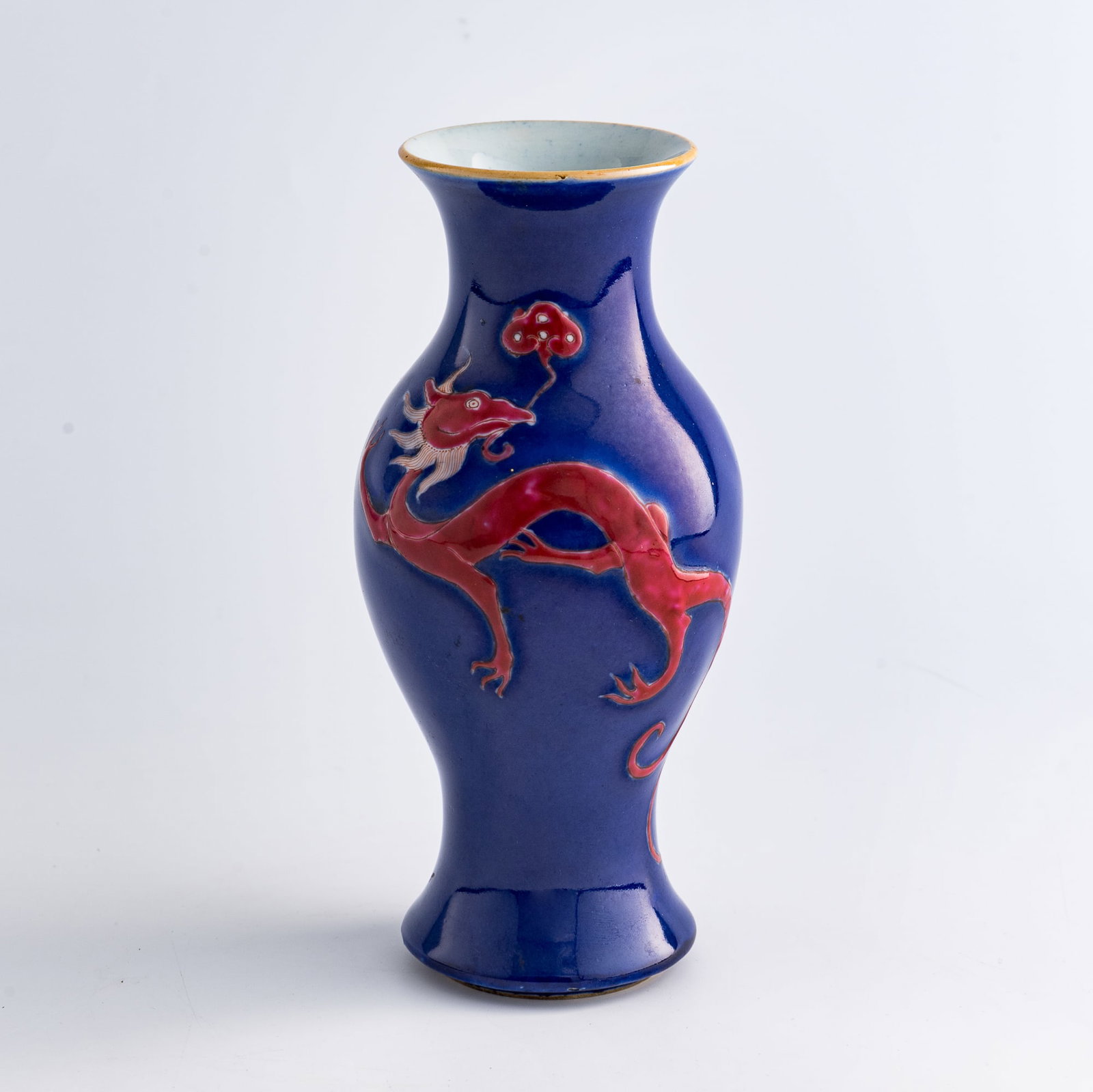 A Chinese blue-glazed iron-red 'dragon' vase, 19th century: A Chinese blue-glazed iron-red 'dragon' vase 19th century H: 8 3/4, Dia: 4 in. (H: 22.2, Dia: 10.2 cm.) From an estate in San Diego, California. Click here for hig
