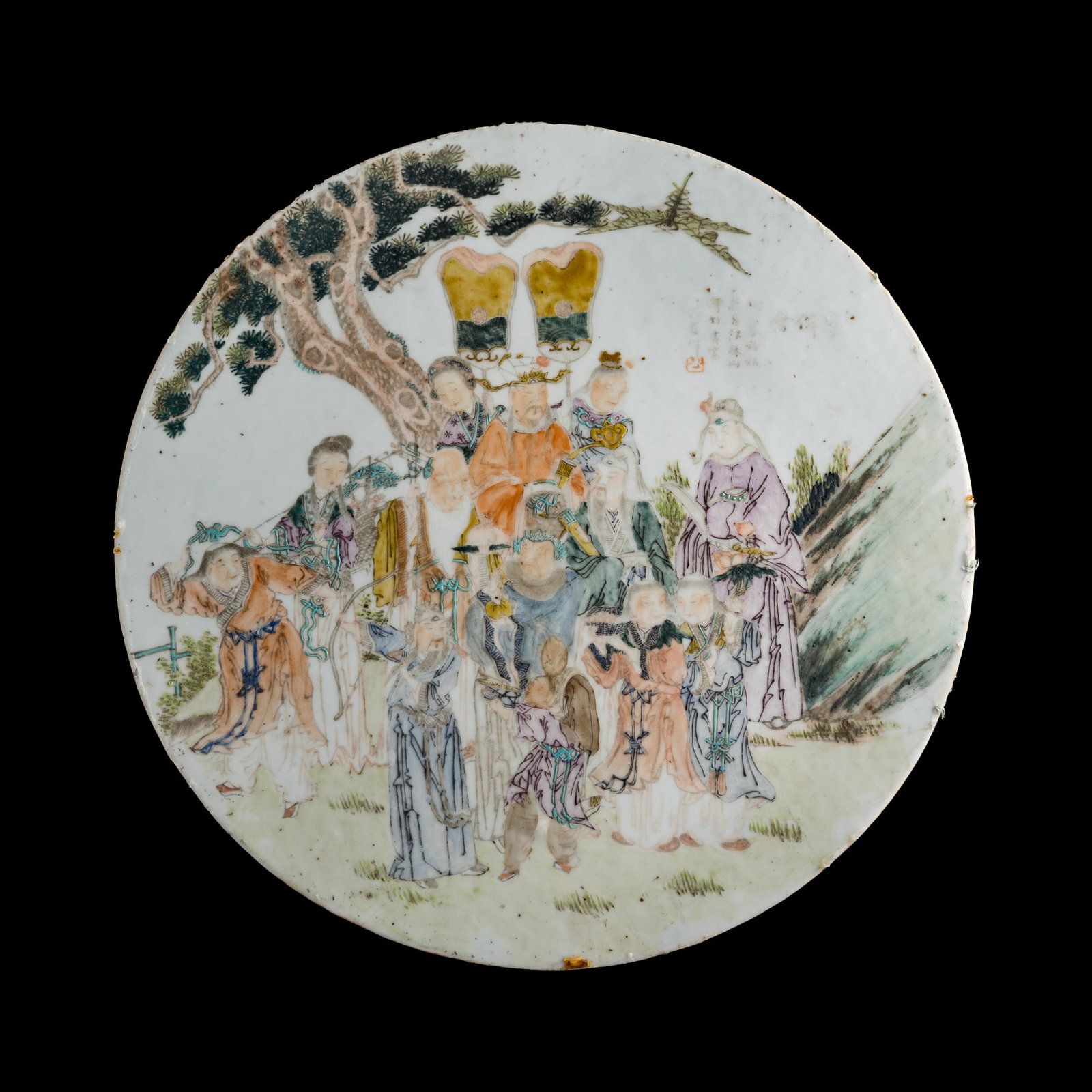 A Chinese Qianjiang-enameled porcelain plaque, late 19th century: A Chinese Qianjiang-enameled porcelain plaque late 19th century Depicting Immortals celebrating longevity scene. D: 1/4, Dia: 14 3/4, in. (D: 0.6, Dia: 37.5 cm.) Private collection, New Jersey.
