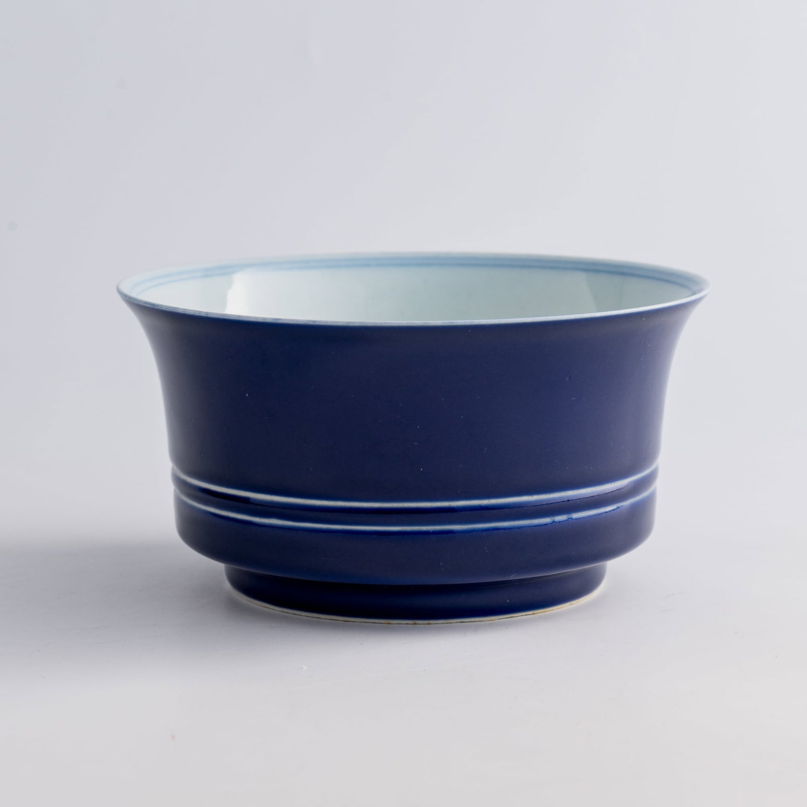 A Chinese sacrificial-blue-glazed ribbed he-form bowl, Yongzheng period, Qing dynasty (1 of 8)