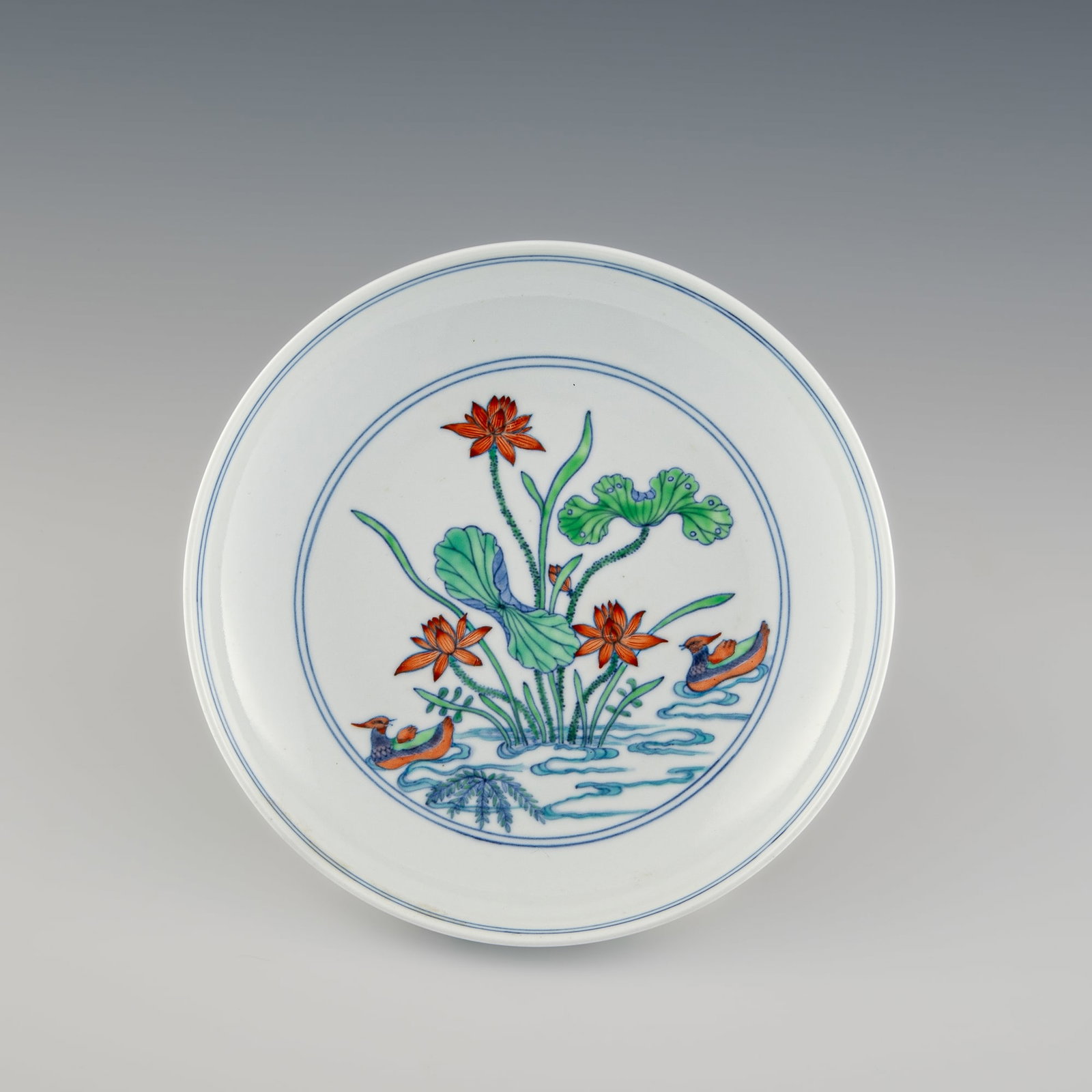 A Chinese Yongzheng-style doucai 'lotus pond' plate, Republic period: A Chinese Yongzheng-style doucai 'lotus pond' plate Republic period With a six-character mark to the underside. Sold with a fitted box. H: 1 1/2, Dia: 7 3/8 in. (H: 3.8, Dia: 18.7 cm.) Private collect