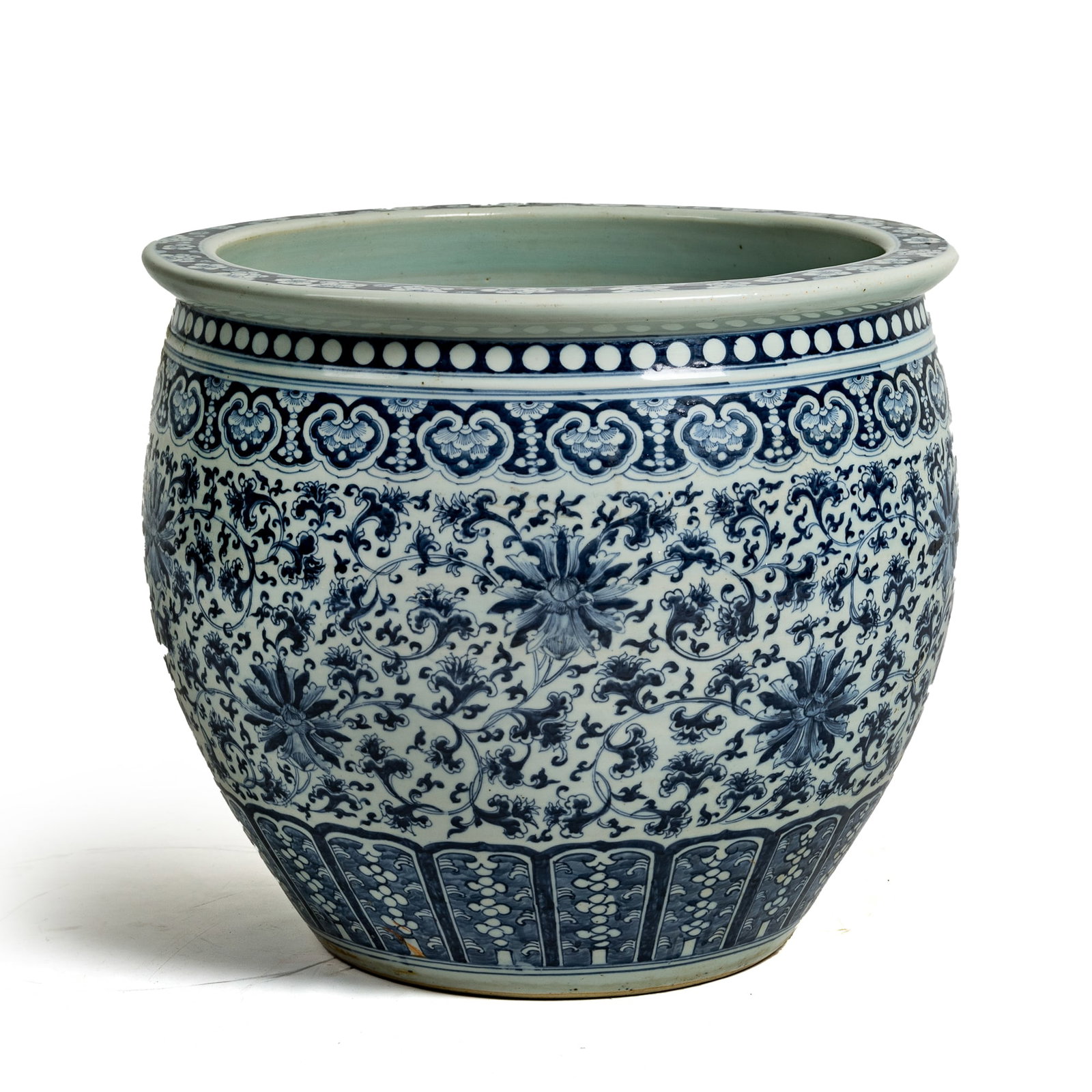 A Chinese blue and white 'lotus scrolls' jar, early 19th century: A Chinese blue and white 'lotus scrolls' jar early 19th century H: 17 3/4, Dia: 20 1/4 in. (H: 45.1, Dia: 51.4 cm.) Private collection, Windermere, Florida. Click
