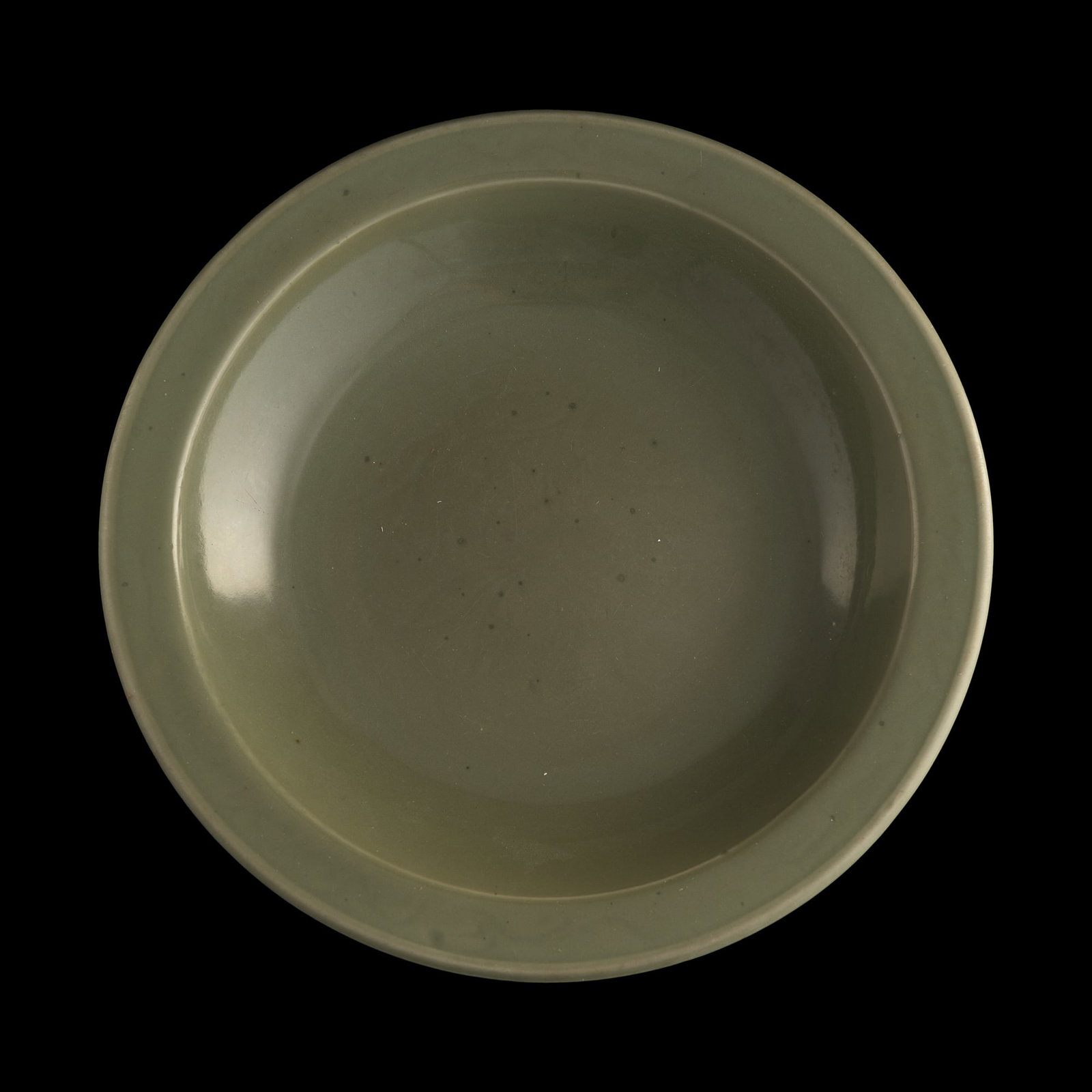 A Chinese carved Longquan celadon charger with everted rim, Ming dynasty (1 of 6)