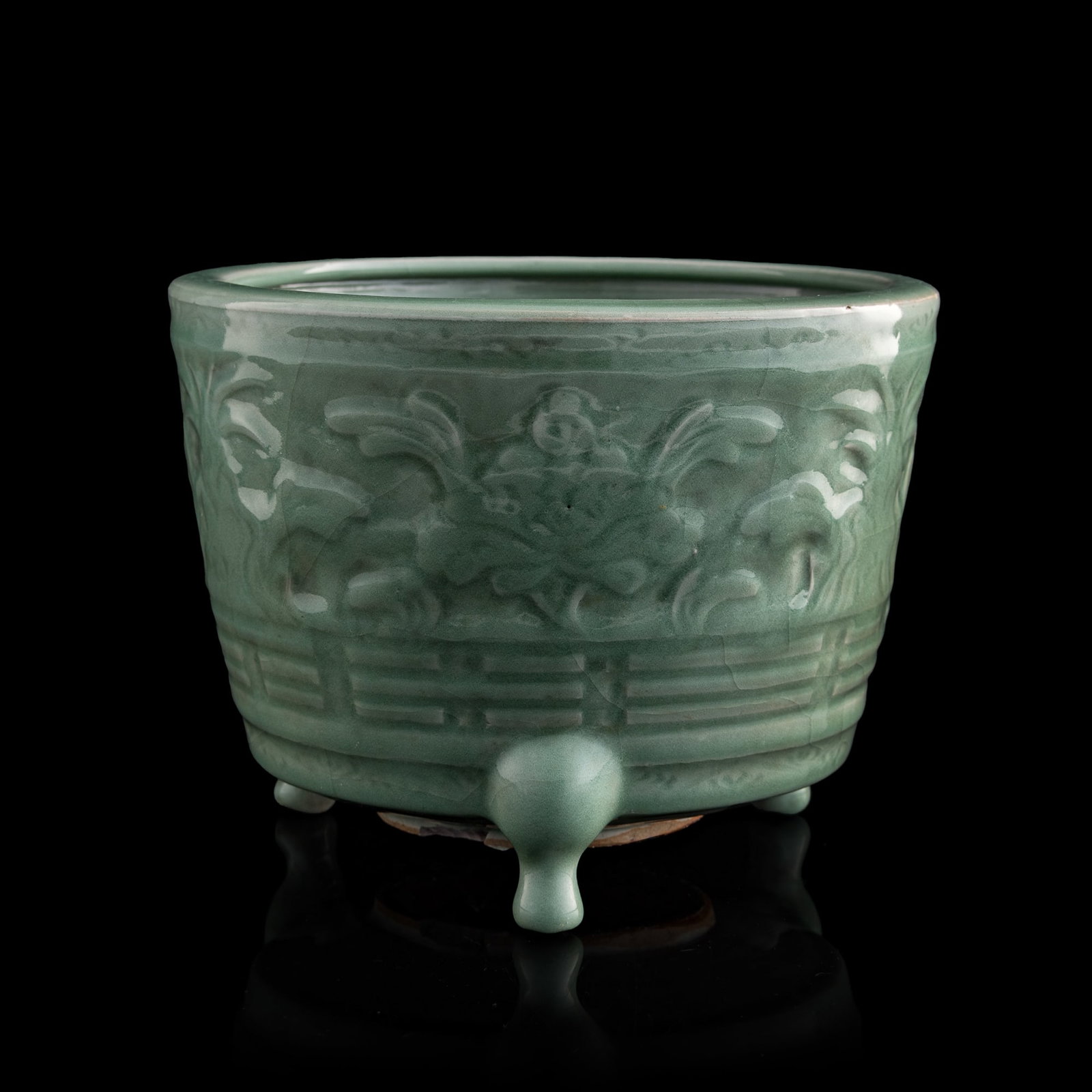A Chinese Longquan celadon floral and bagua tripod censer, Ming dynasty (1 of 8)