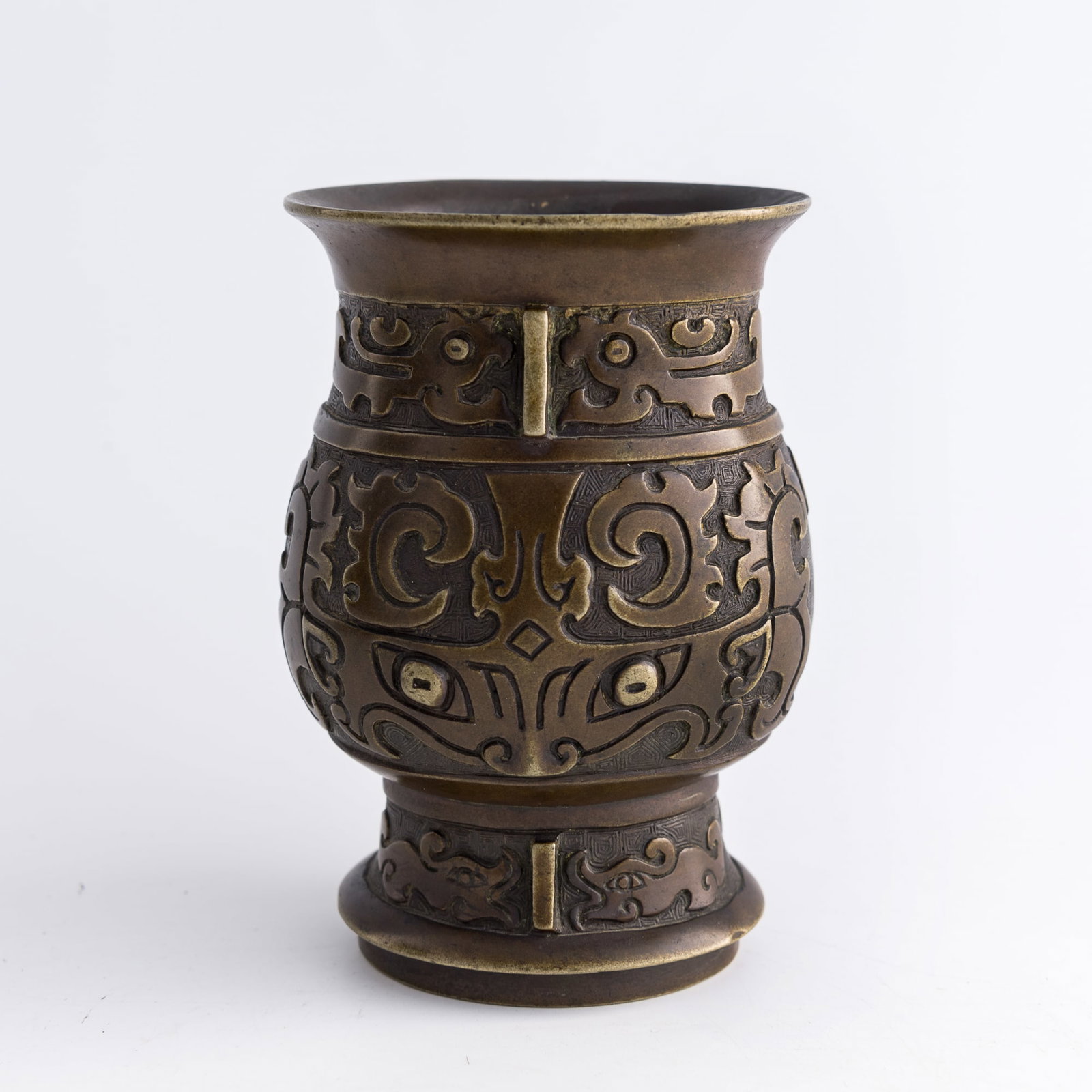 A Chinese bronze 'taotie' zun vase, Qing dynasty (1 of 8)