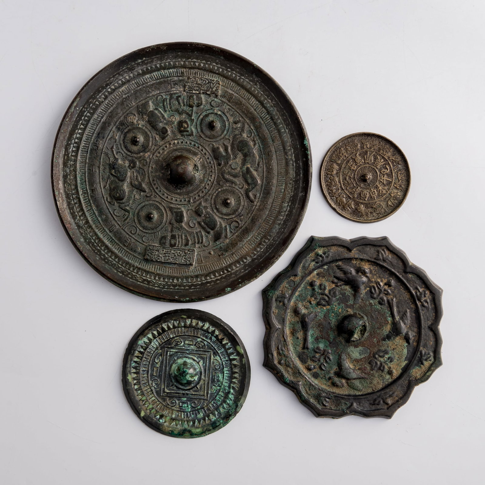 Four assorted Chinese bronze mirrors, Han/Song dynasty (1 of 7)