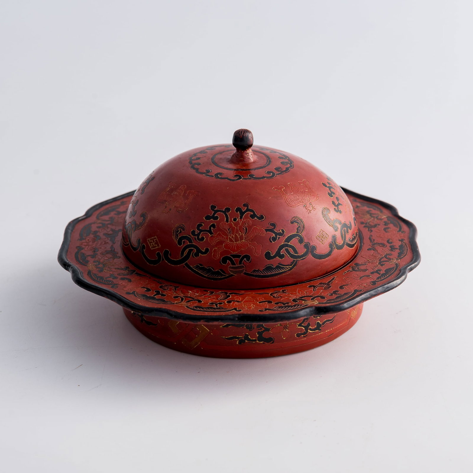 A Chinese polychrome-painted red lacquer zhadou, Qianlong period, Qing dynasty: A Chinese polychrome-painted red lacquer zhadou Qianlong period, Qing dynasty H: 3 1/4, Dia: 6 in. (H: 8.3, Dia: 15.2 cm.) Private collection, New York. Click here